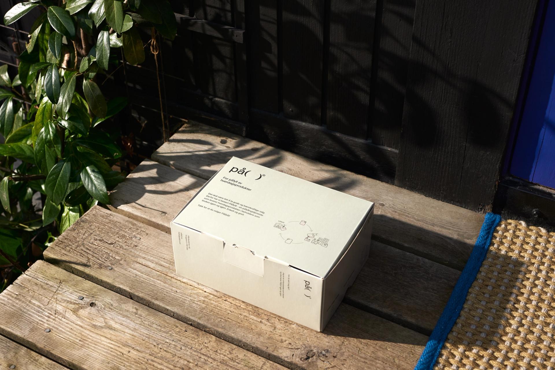 Cardboard box delivered on a doorstep