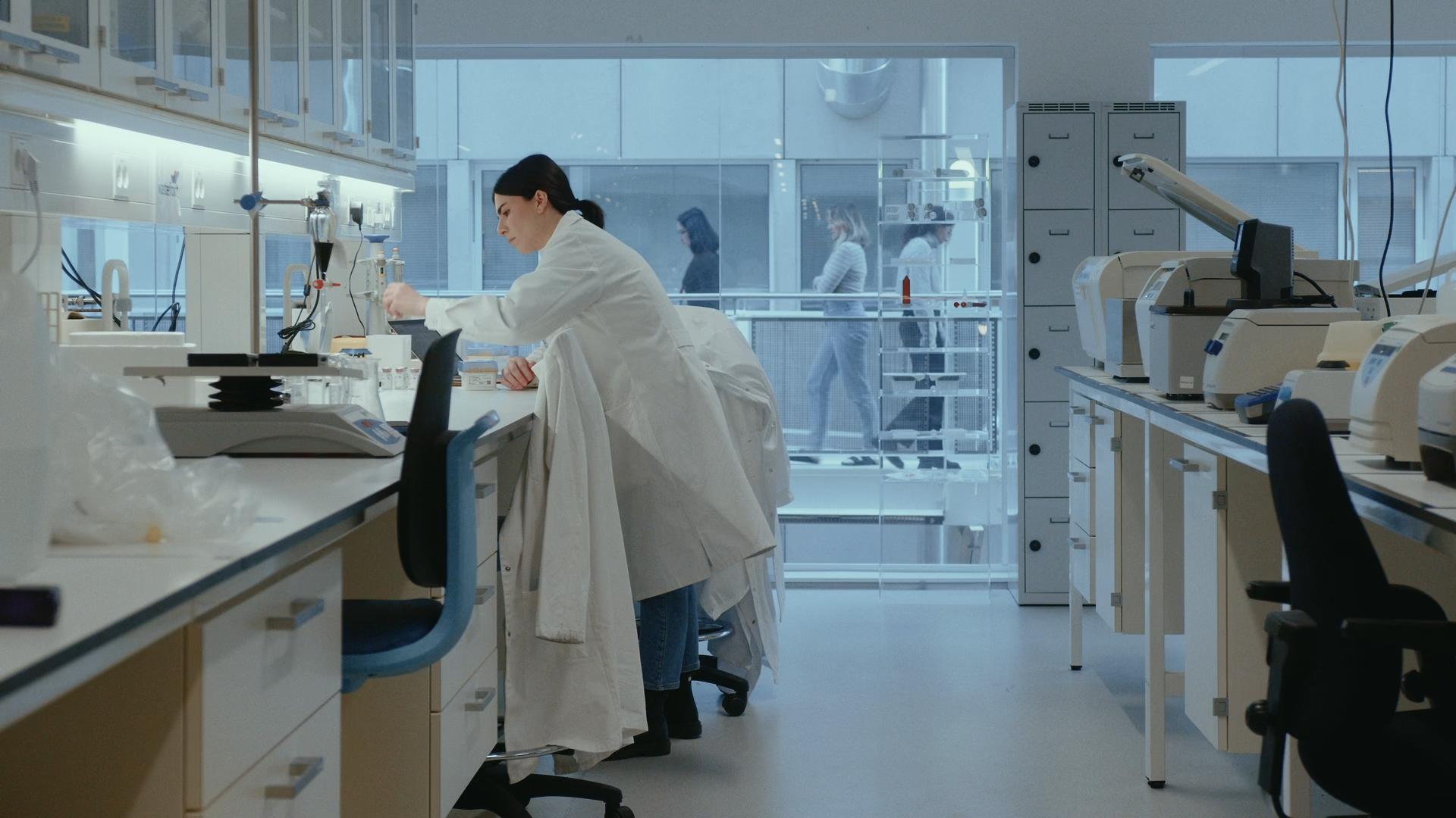 Female scientist in a white lab coat in a lab