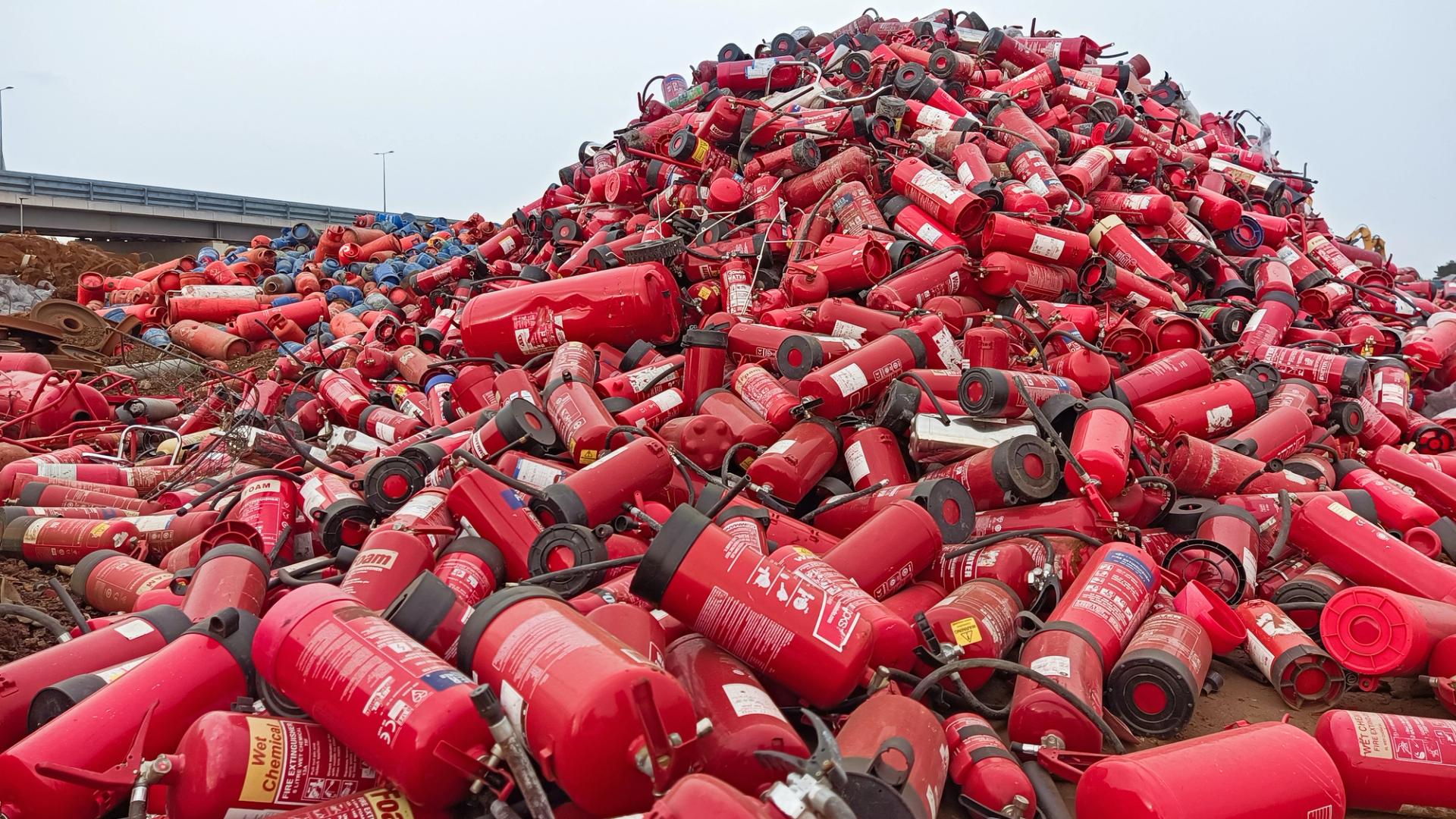 Huge pile of used fire extiguishers