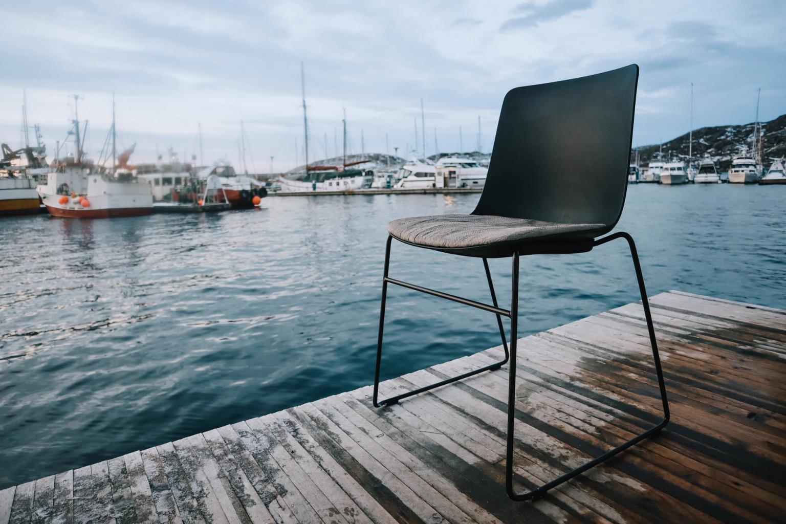 Chair with salmon skin seat on a dock
