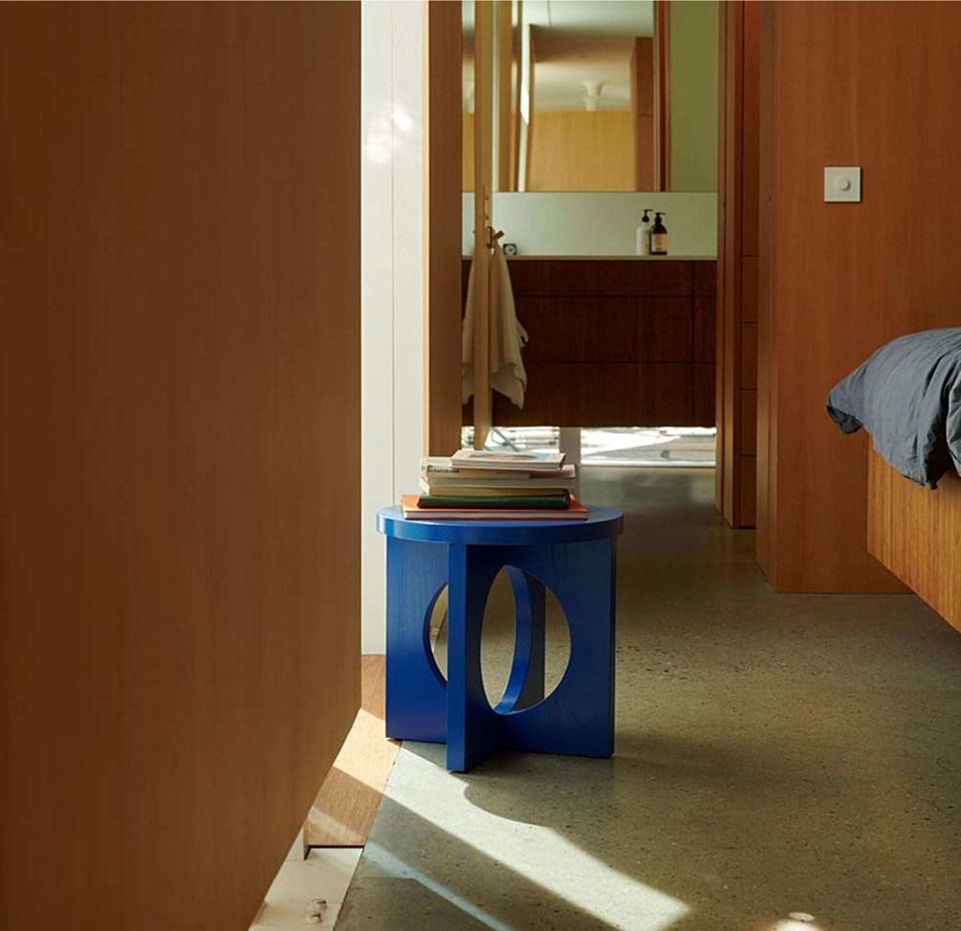 blue side table with cut outs