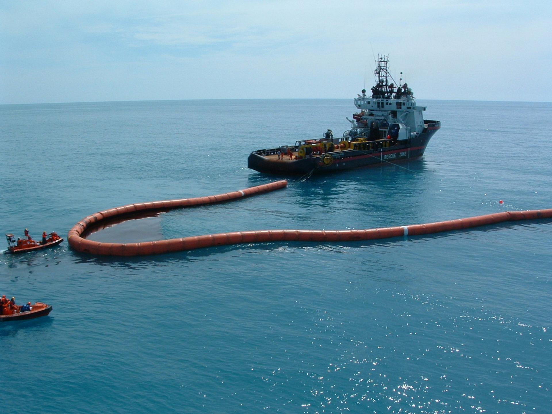 offshore oil boom towed by a vessel