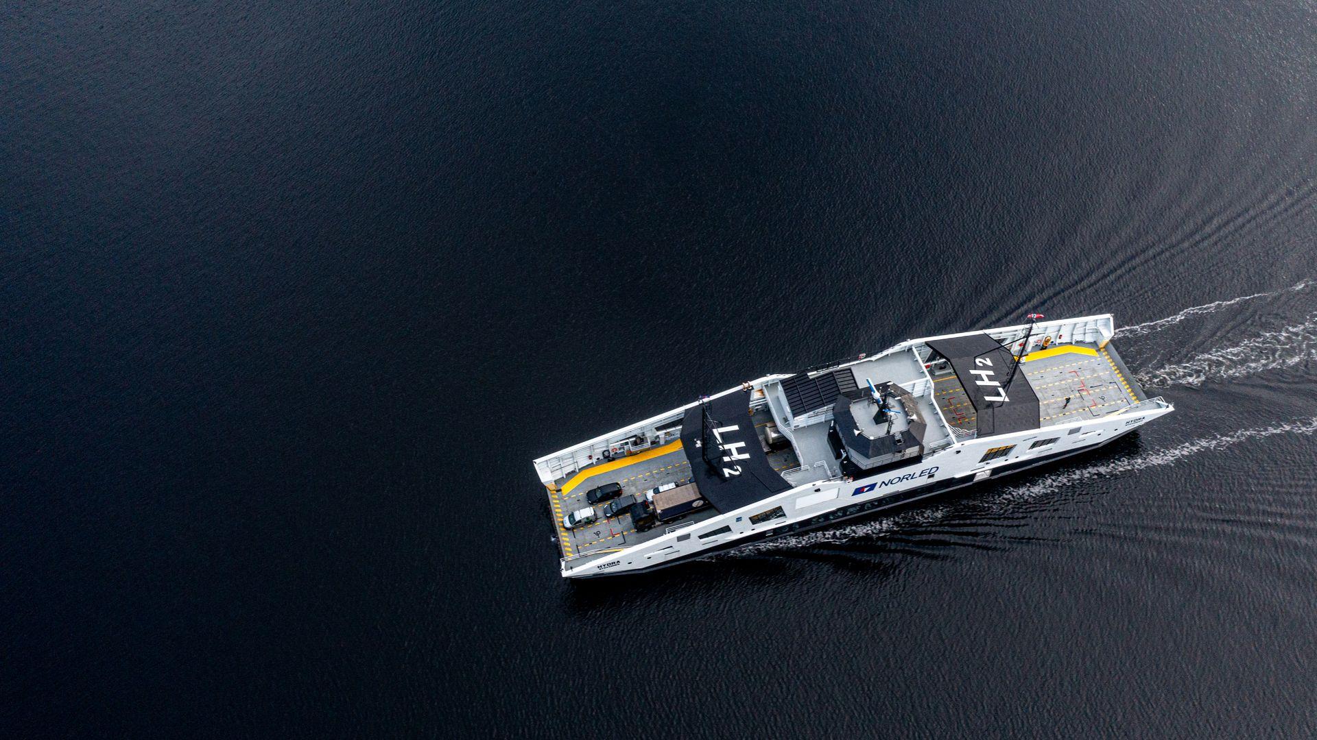 Hydrogen-powered ferry floating across the ocean