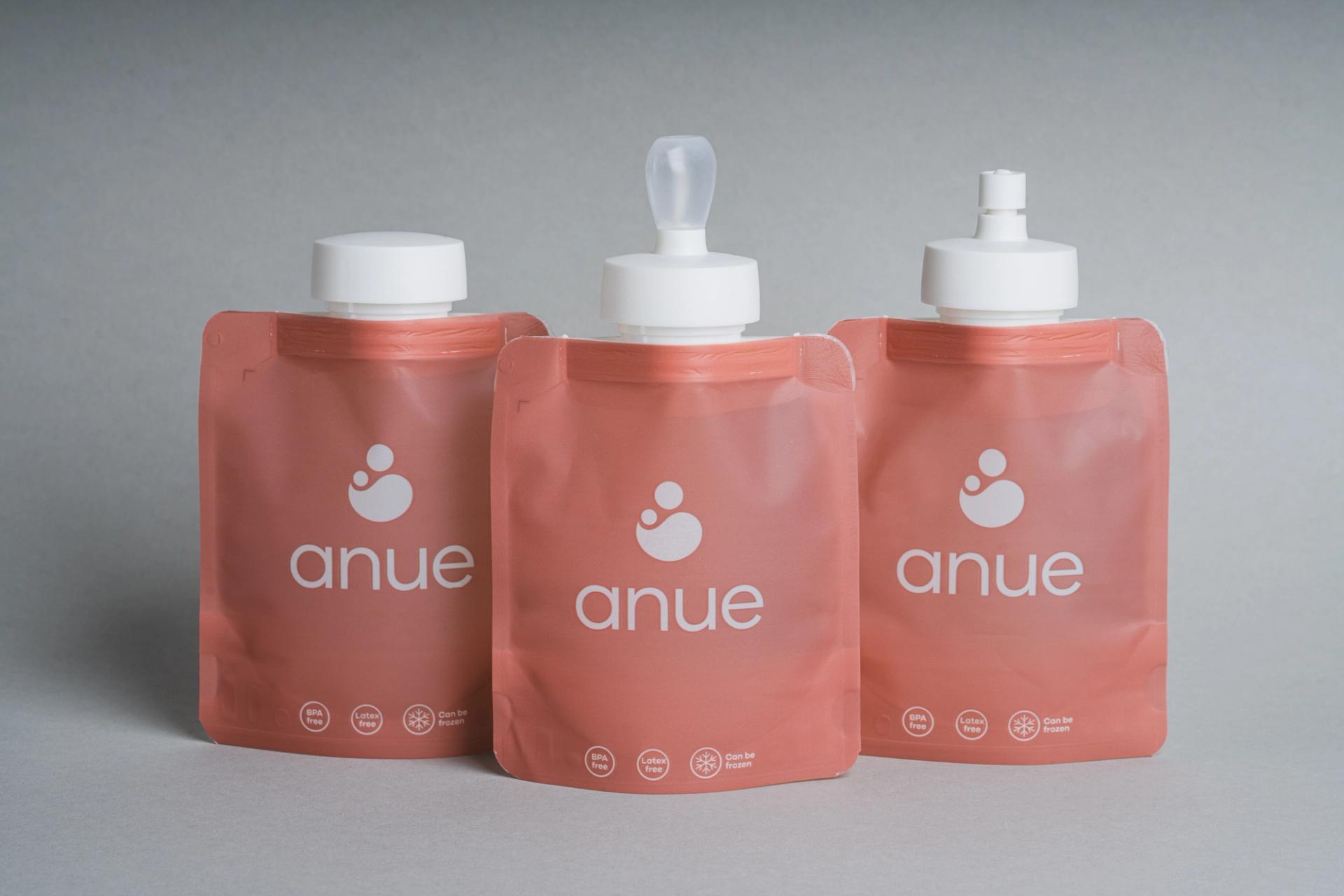 Pink pouches with white tops for storage of breast milk