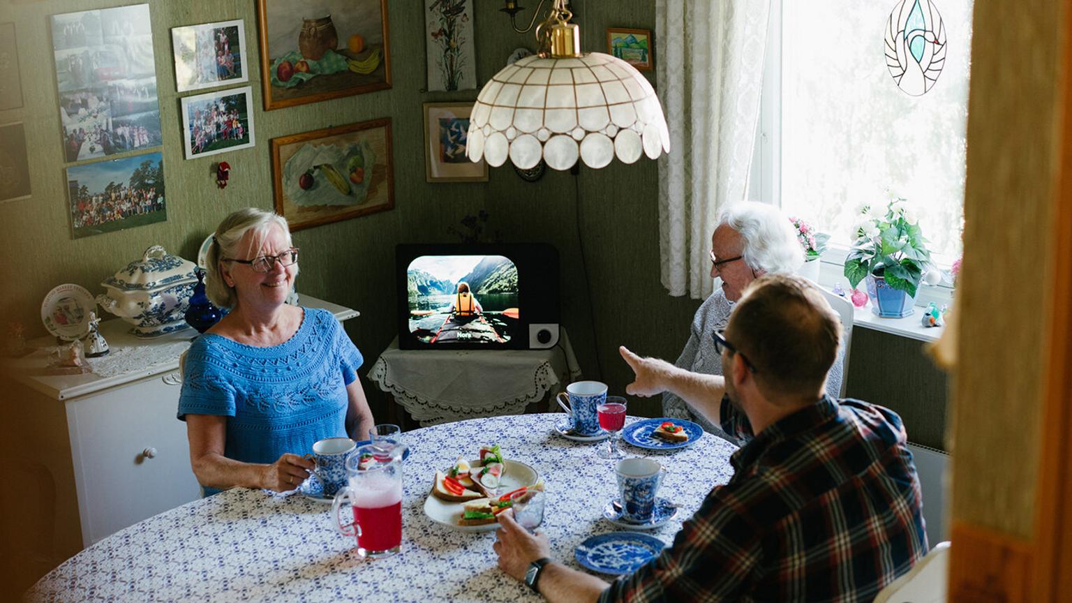 Old people sitting in kitchen