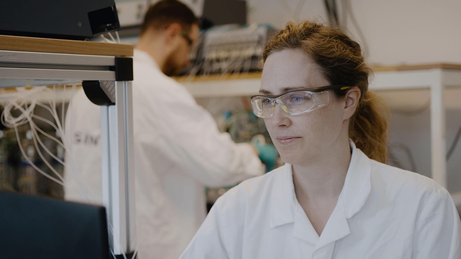 Woman in a lab with glasses
