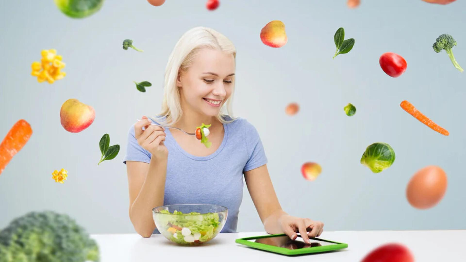 Woman using her IPad while eating