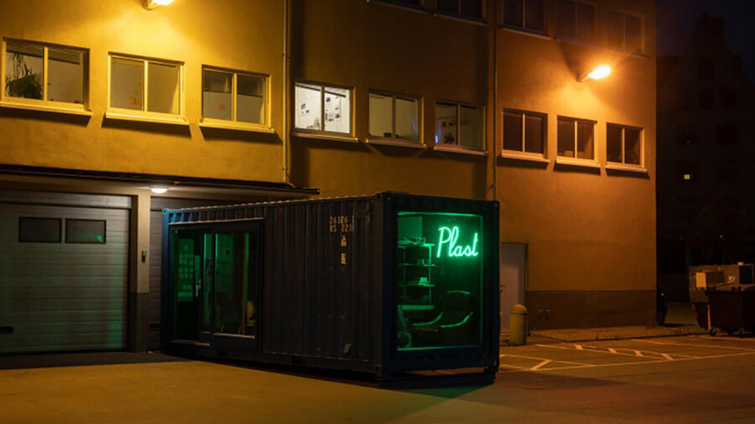 Container with green neon lights inside