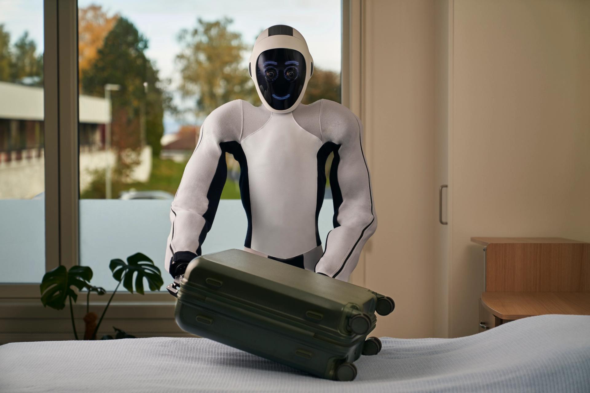 1X  EVE white robot packing a green suitcase on a white bed