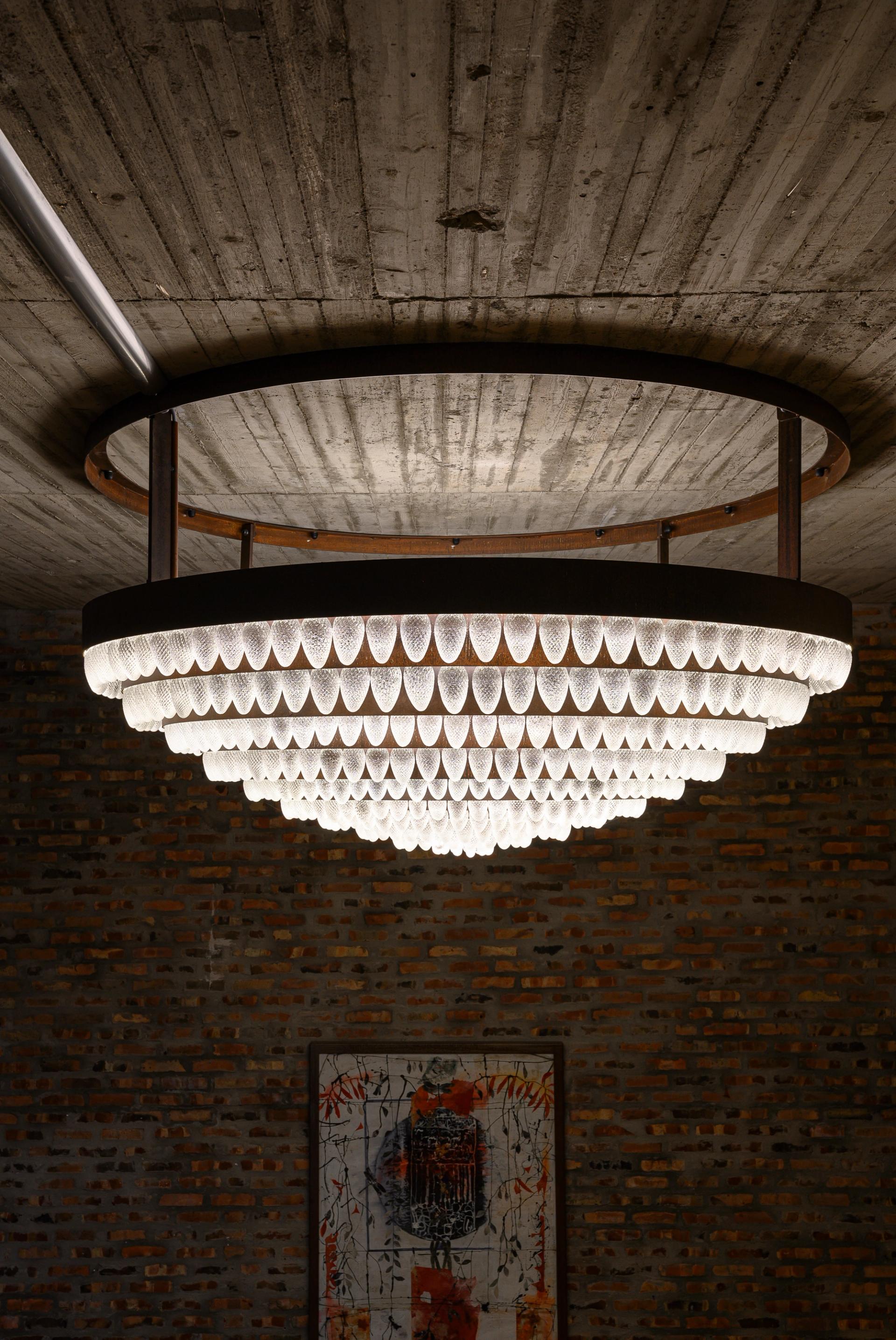 Chandelier hanging from a wooden ceiling