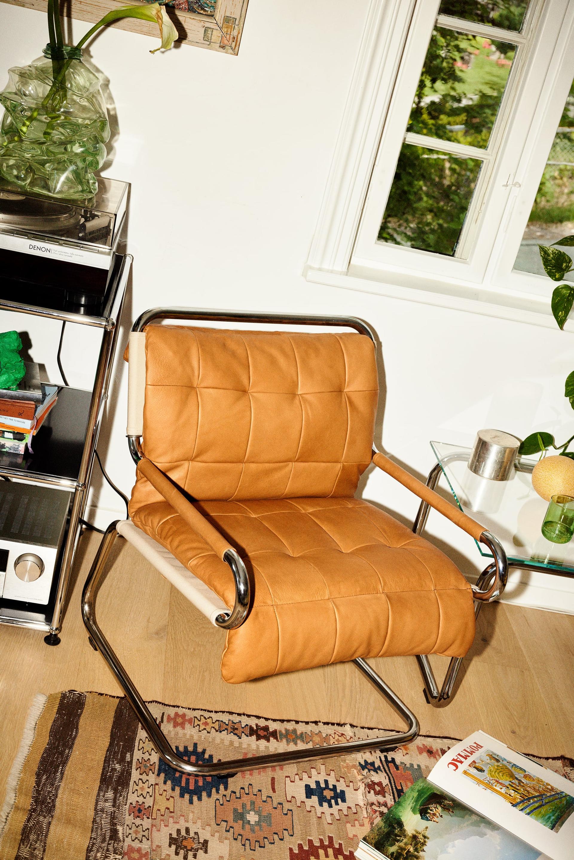 chair with a metal tube frame and cognac colored leather upholstery
