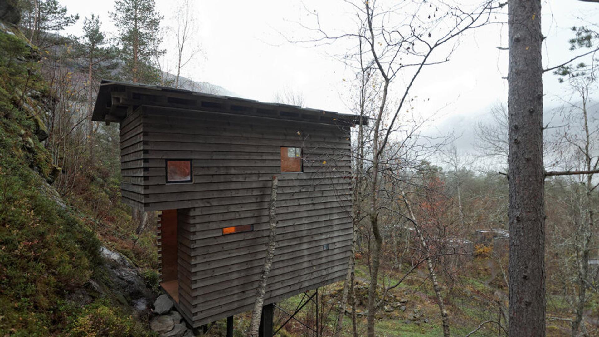 Wooden hotel room, single building in the woods