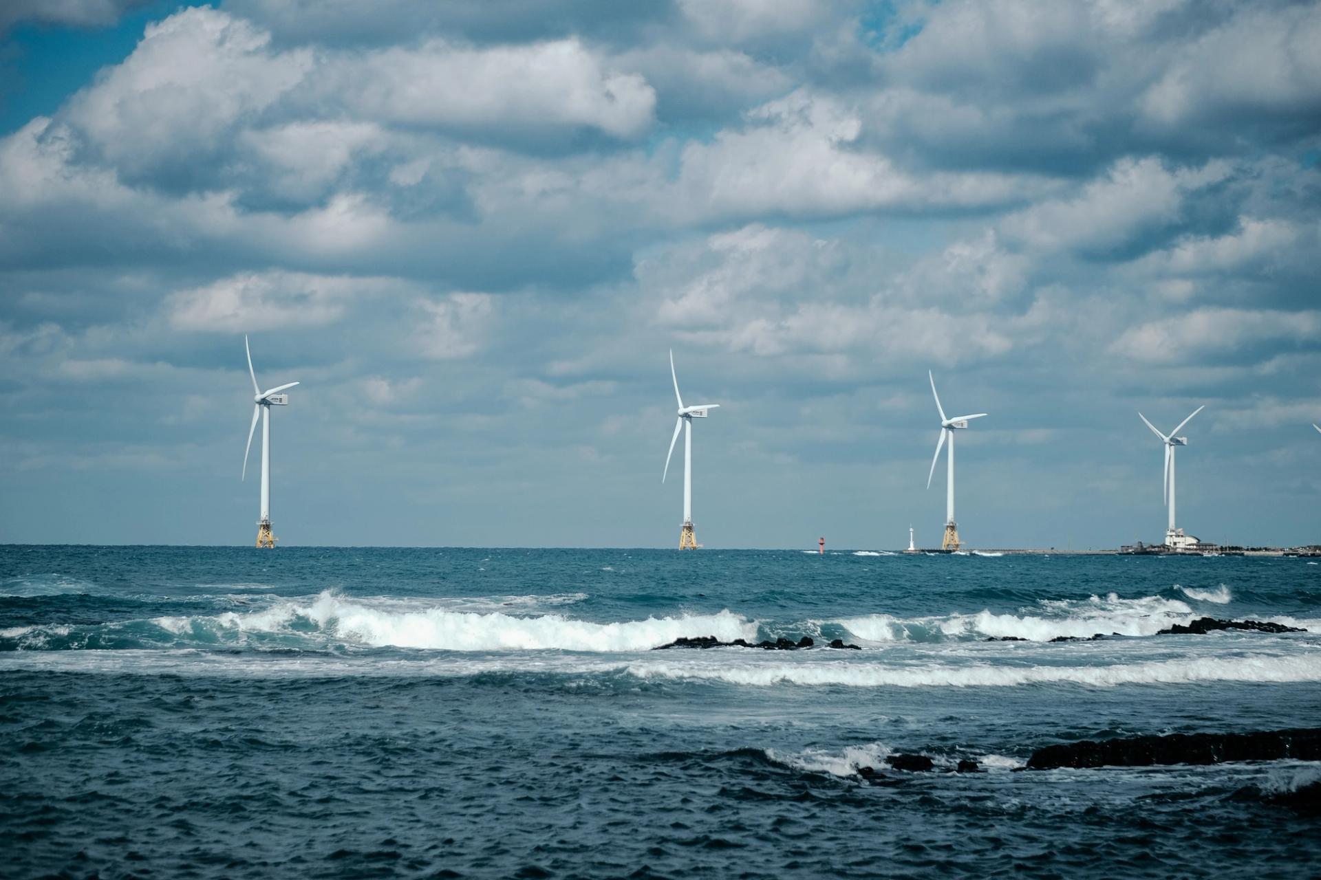 Four wind turbines in the ocean in South Korea