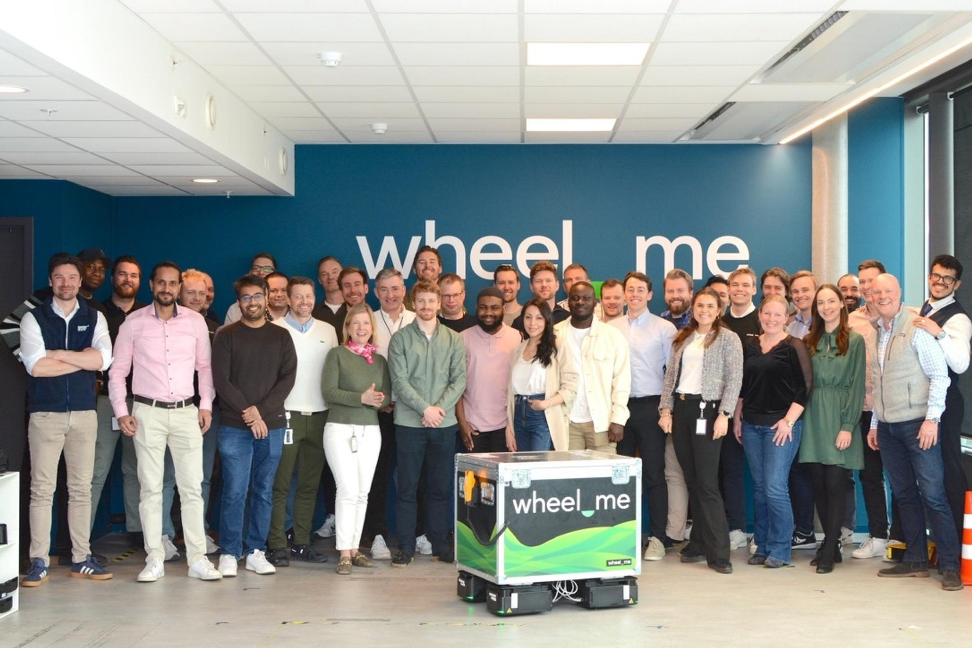 A group picture with a lot of employees from wheel.me.