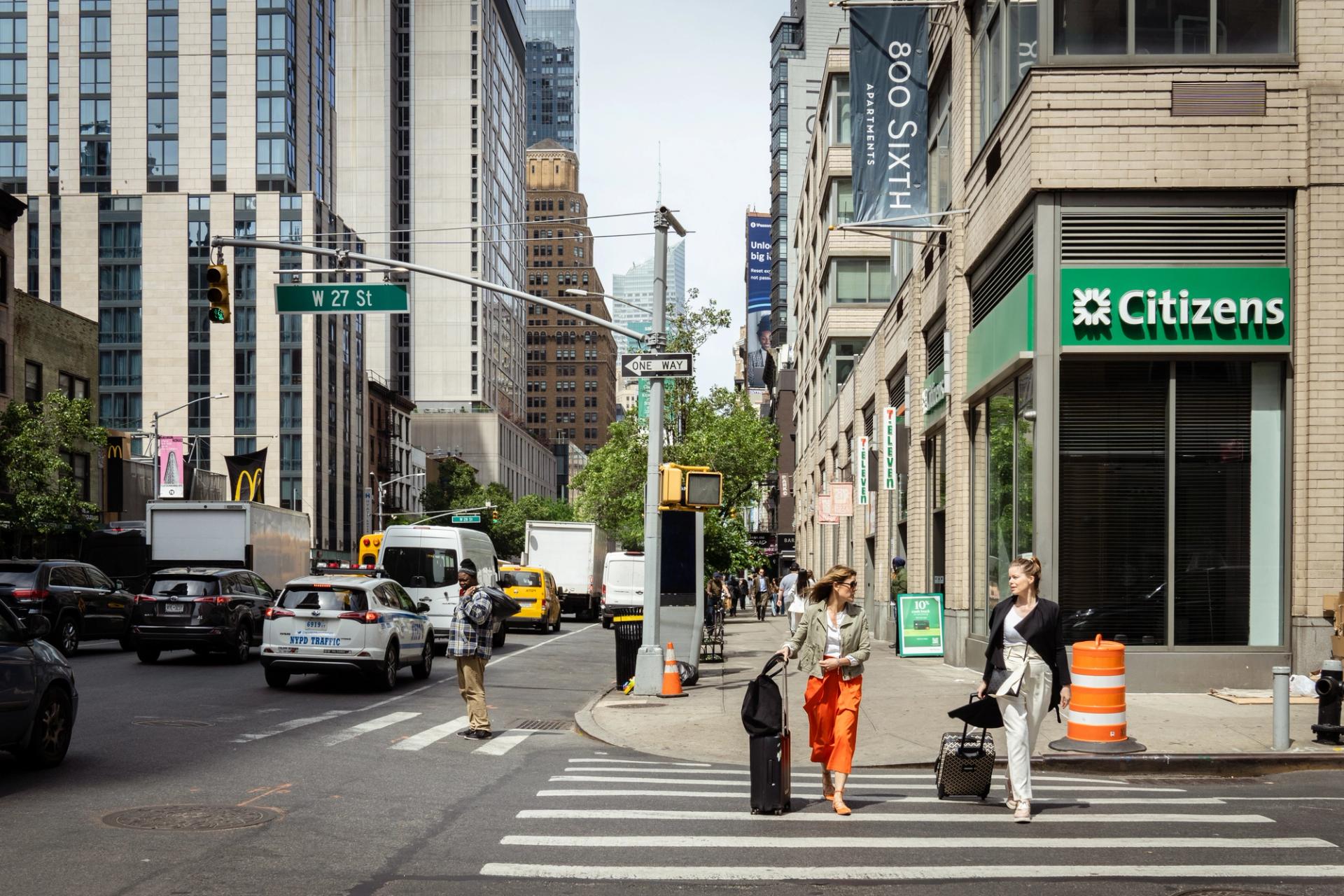 Two woman crossing a street in Manhattan