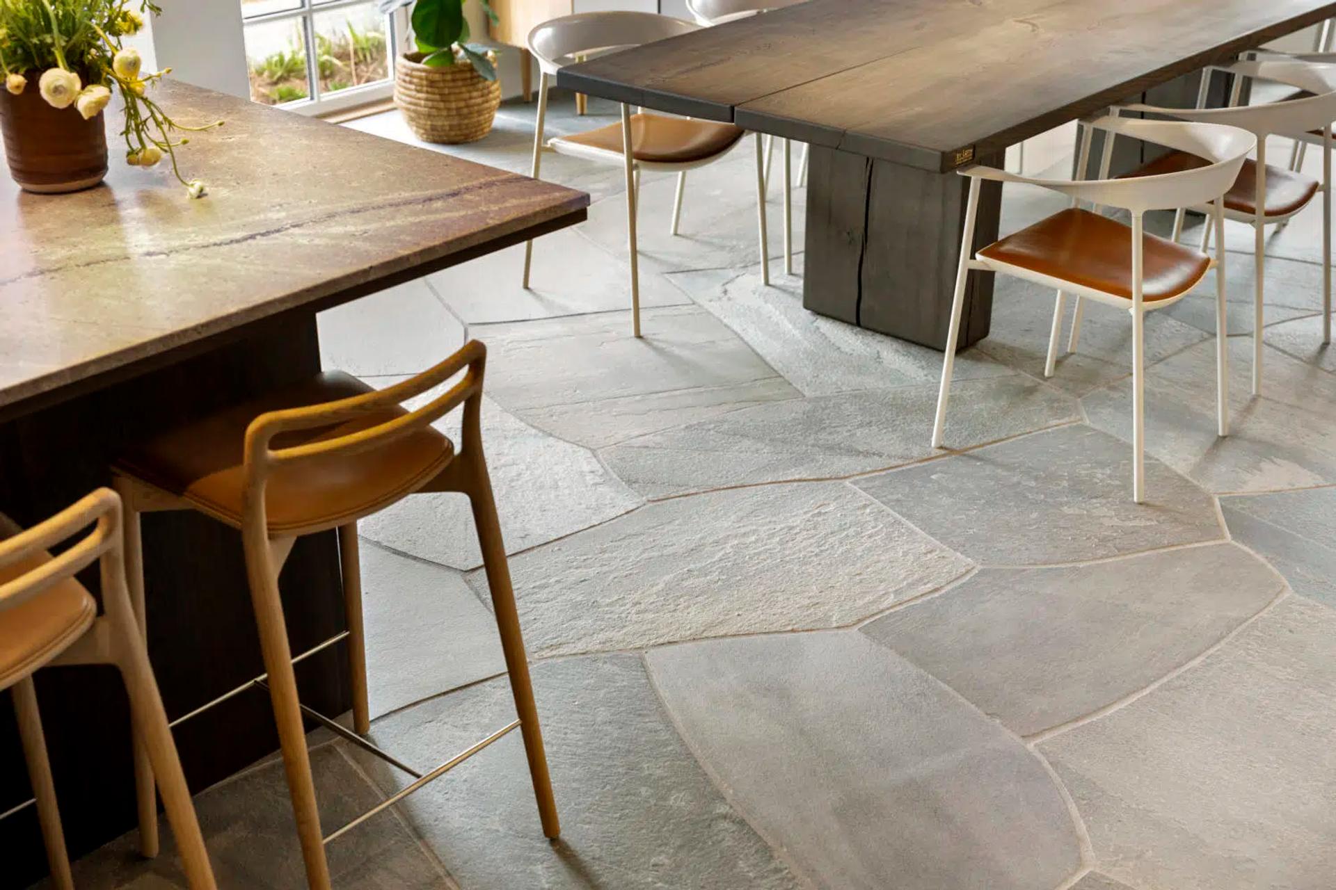 dining room tables and chairs on slate floors