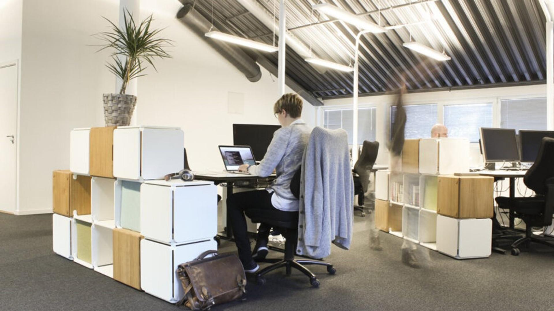 Man sitting in an open office landscape