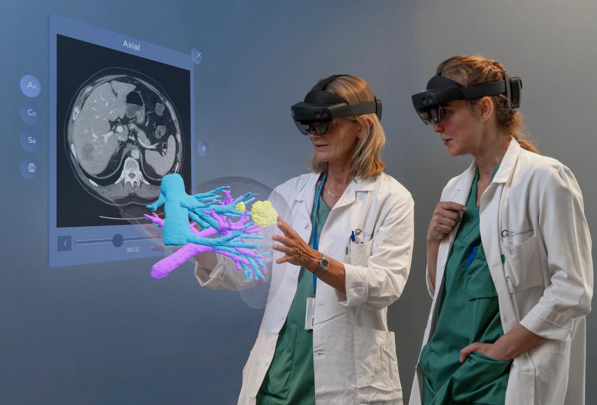 Two doctors looking at a hologram of a liver.