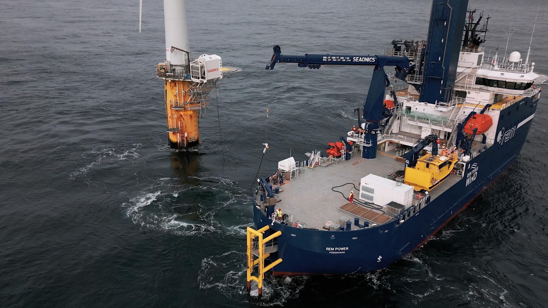 Charger for offshore wind vessels attached to an offshore wind turbine