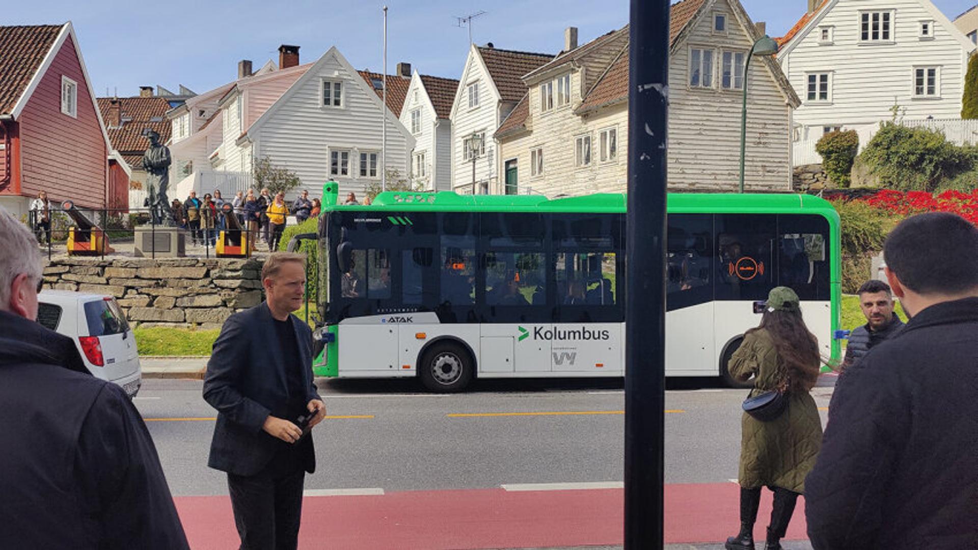 People standing around bus