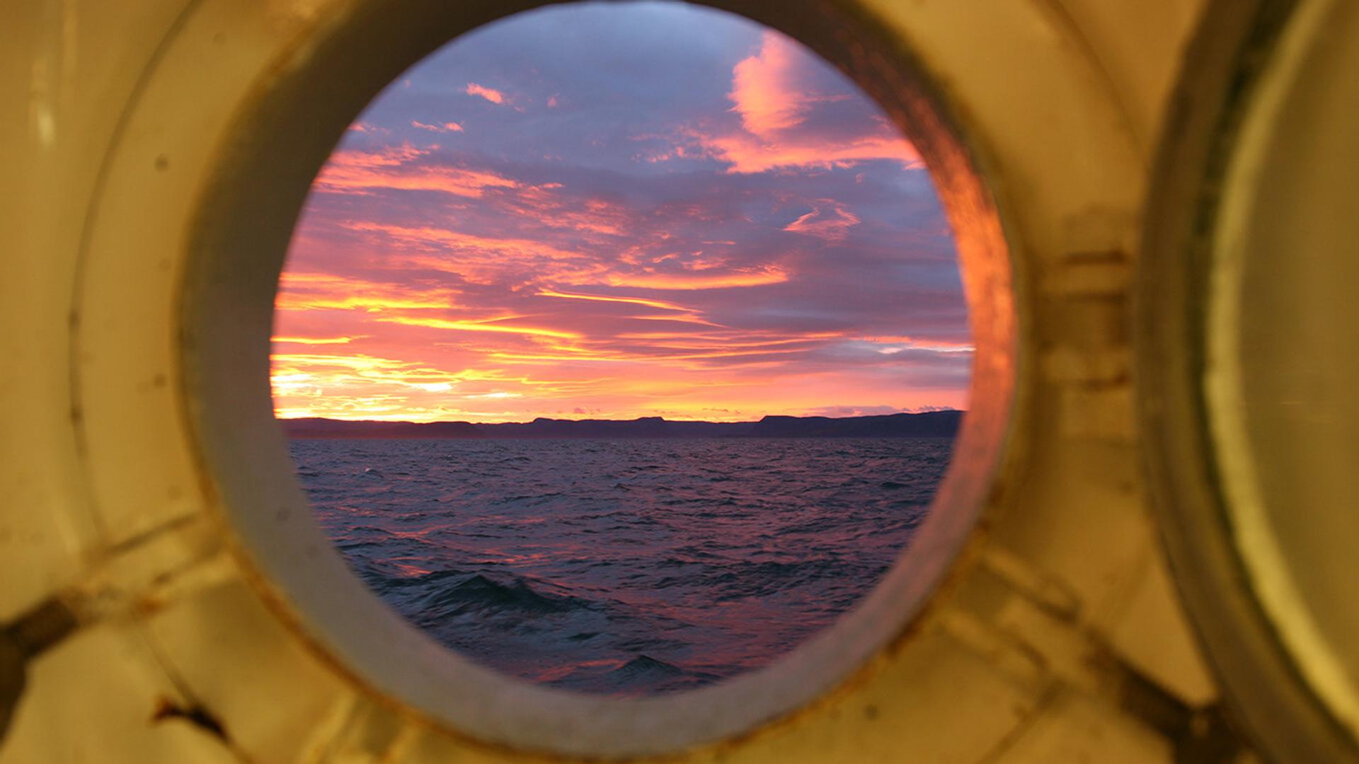 Sunset through window on boat