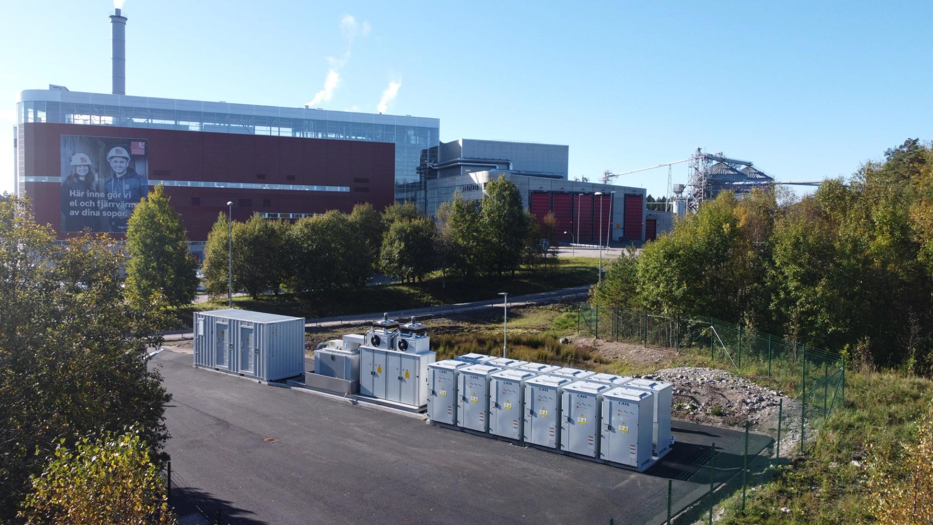 Battery storage units in front of a factory