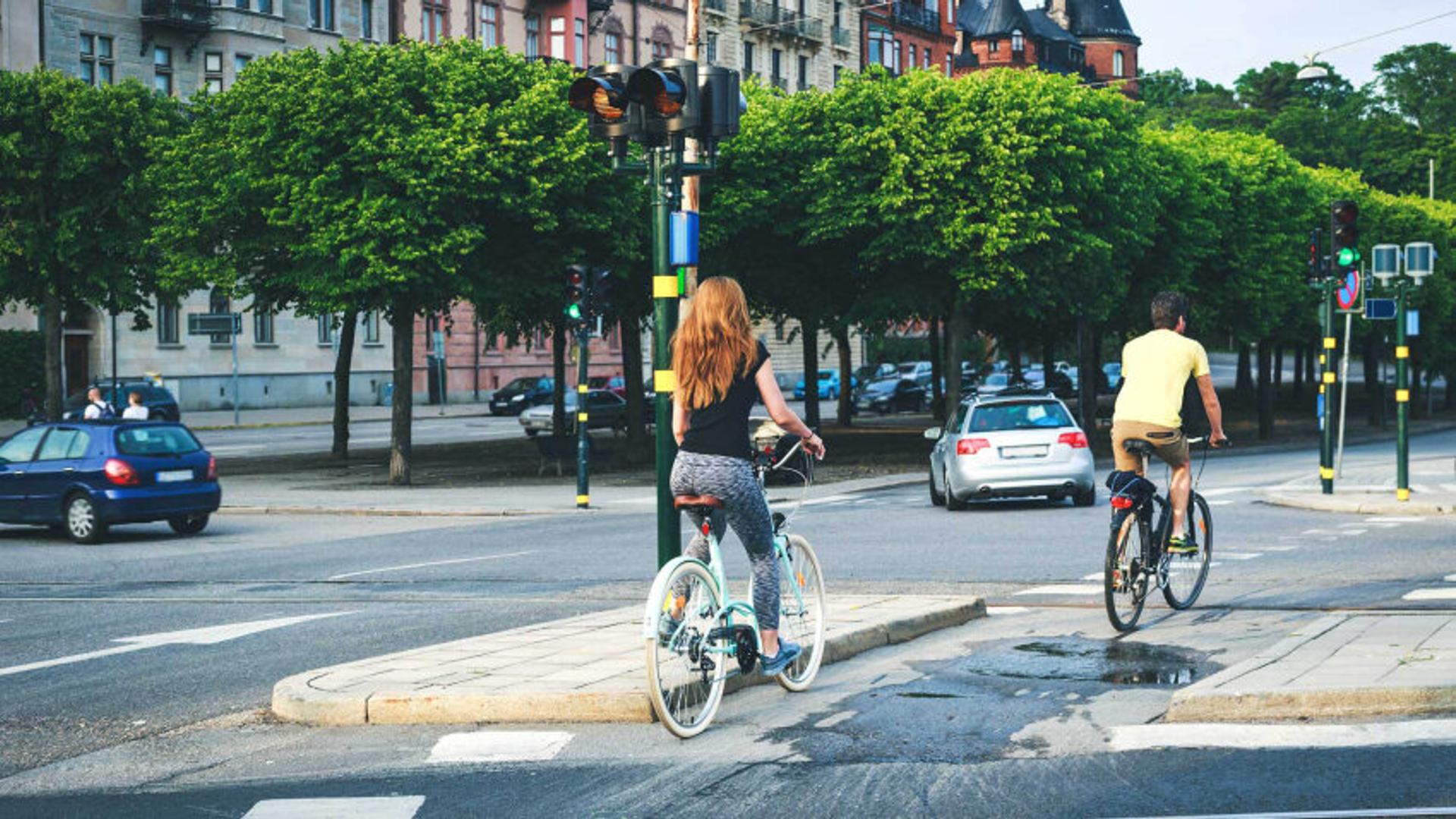 People biking through city