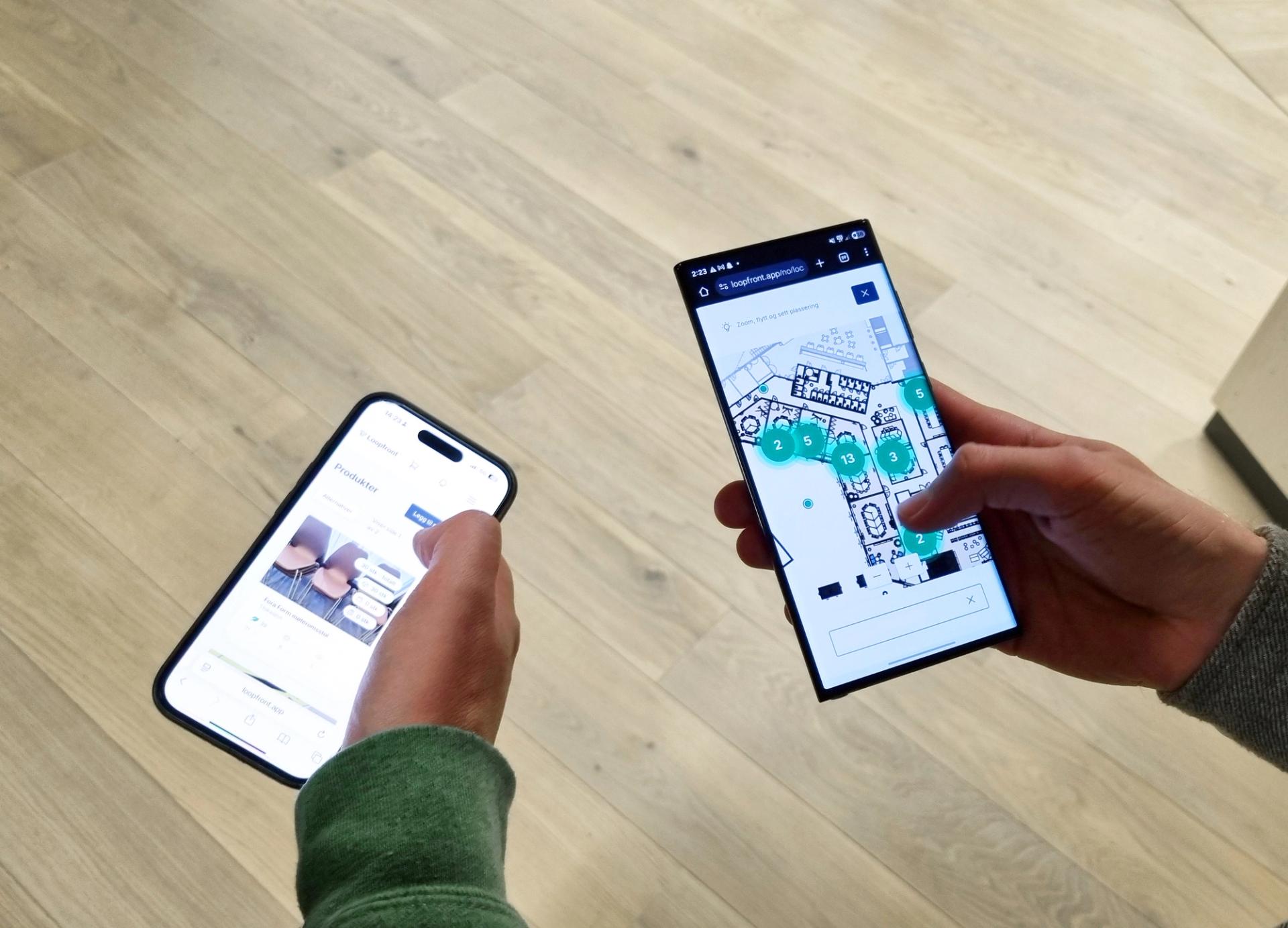 Two men holding smartphones next to each other