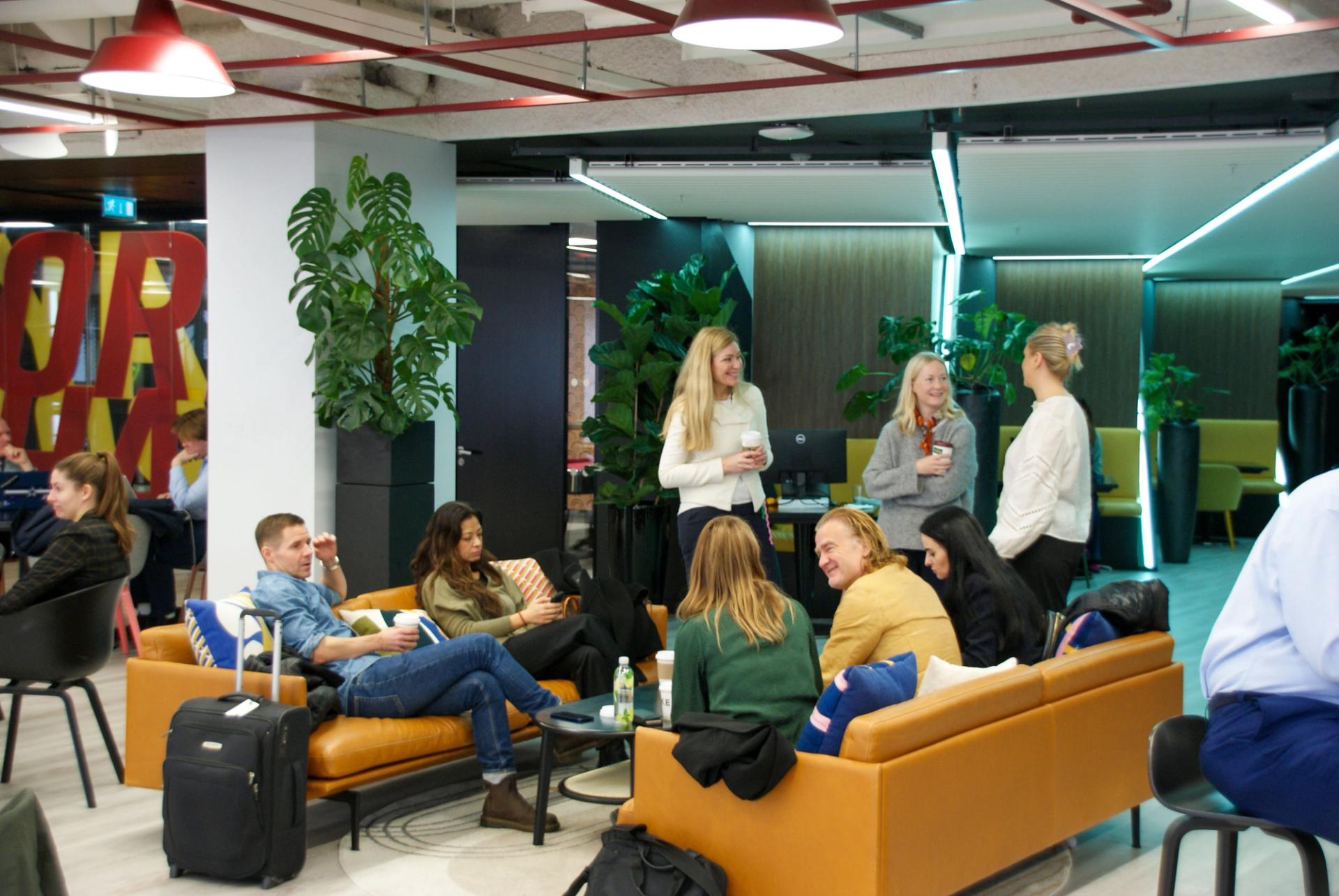 People mingling at a workshop in a colorful room