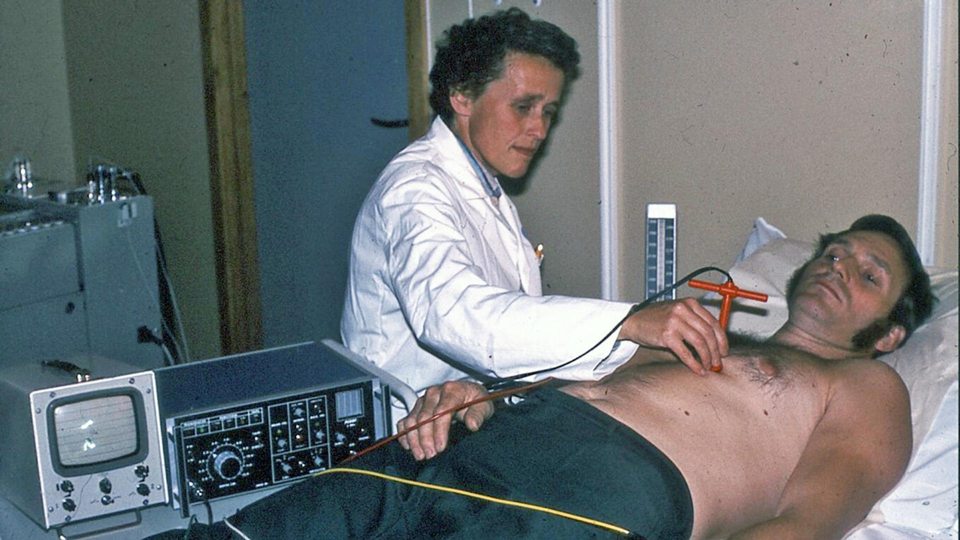 Woman doing ultrasound on patient