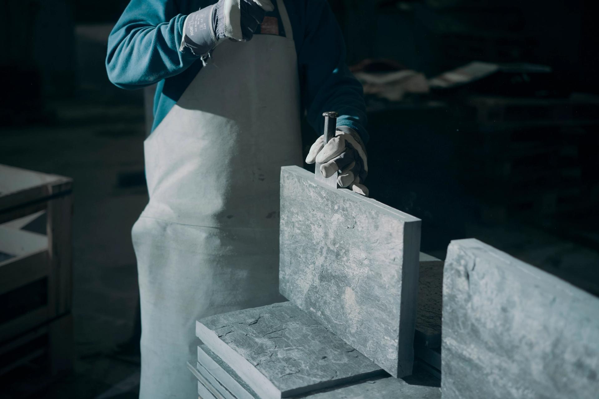 Worker making slate tiles