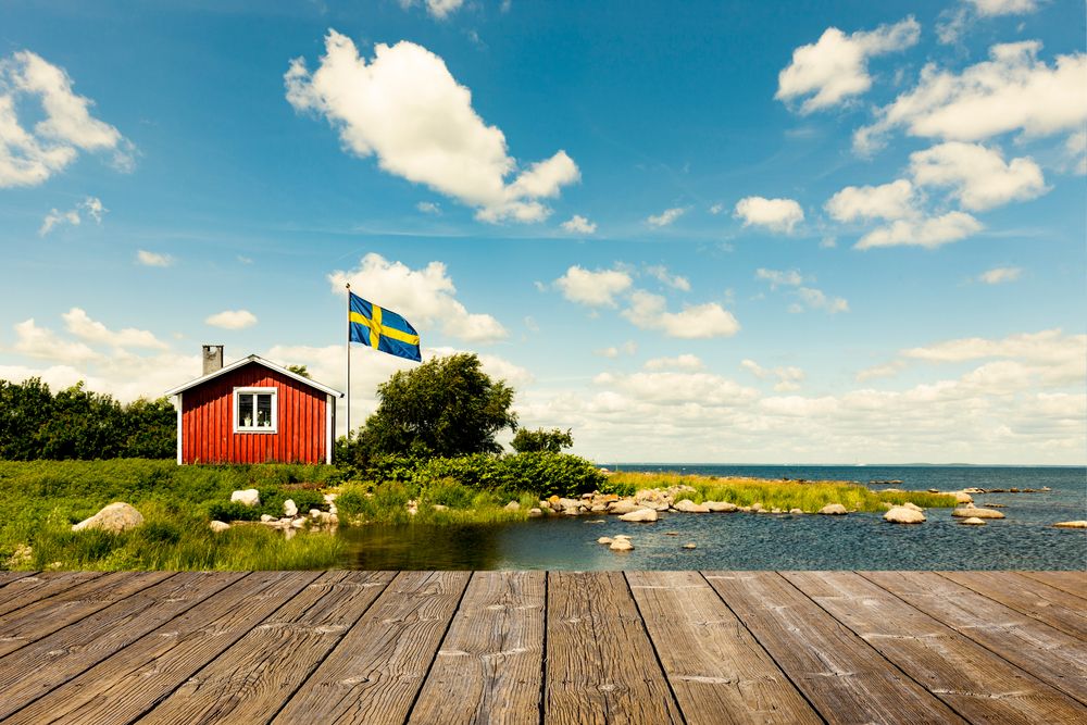 Red Swedish house with wooden terrace Medium