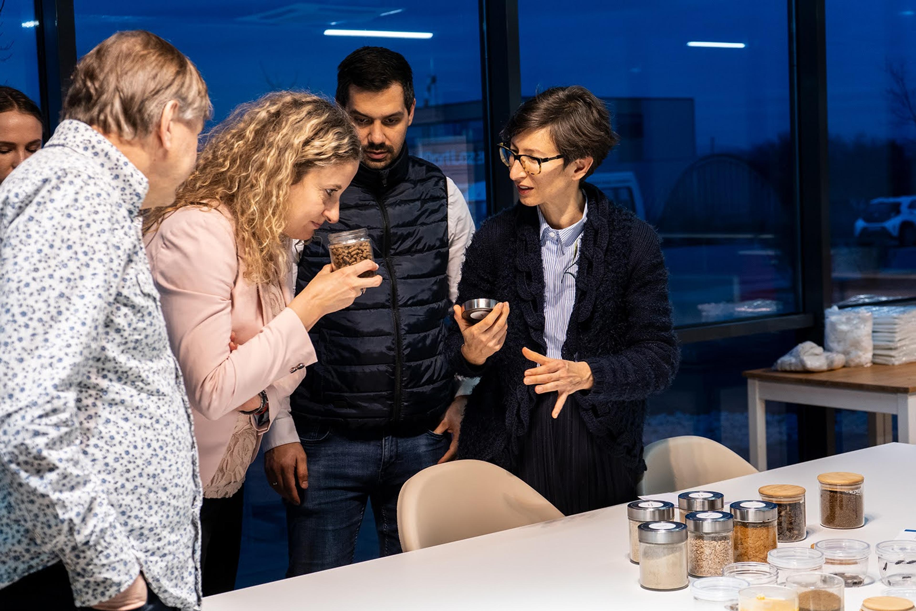 A picture of four people, smelling the different products delivered by nasekomo