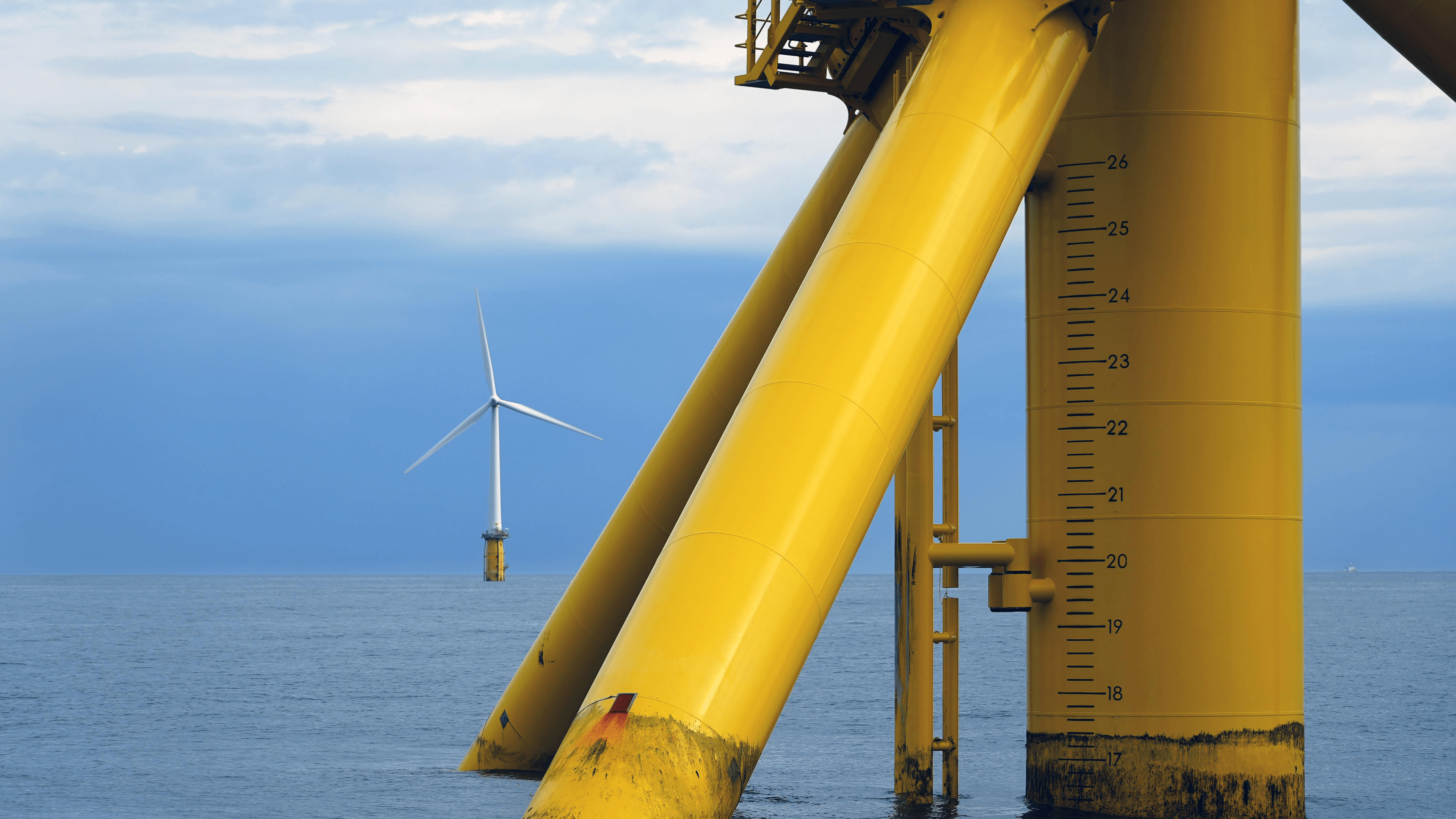 A photo of an offshore wind mill on the sea