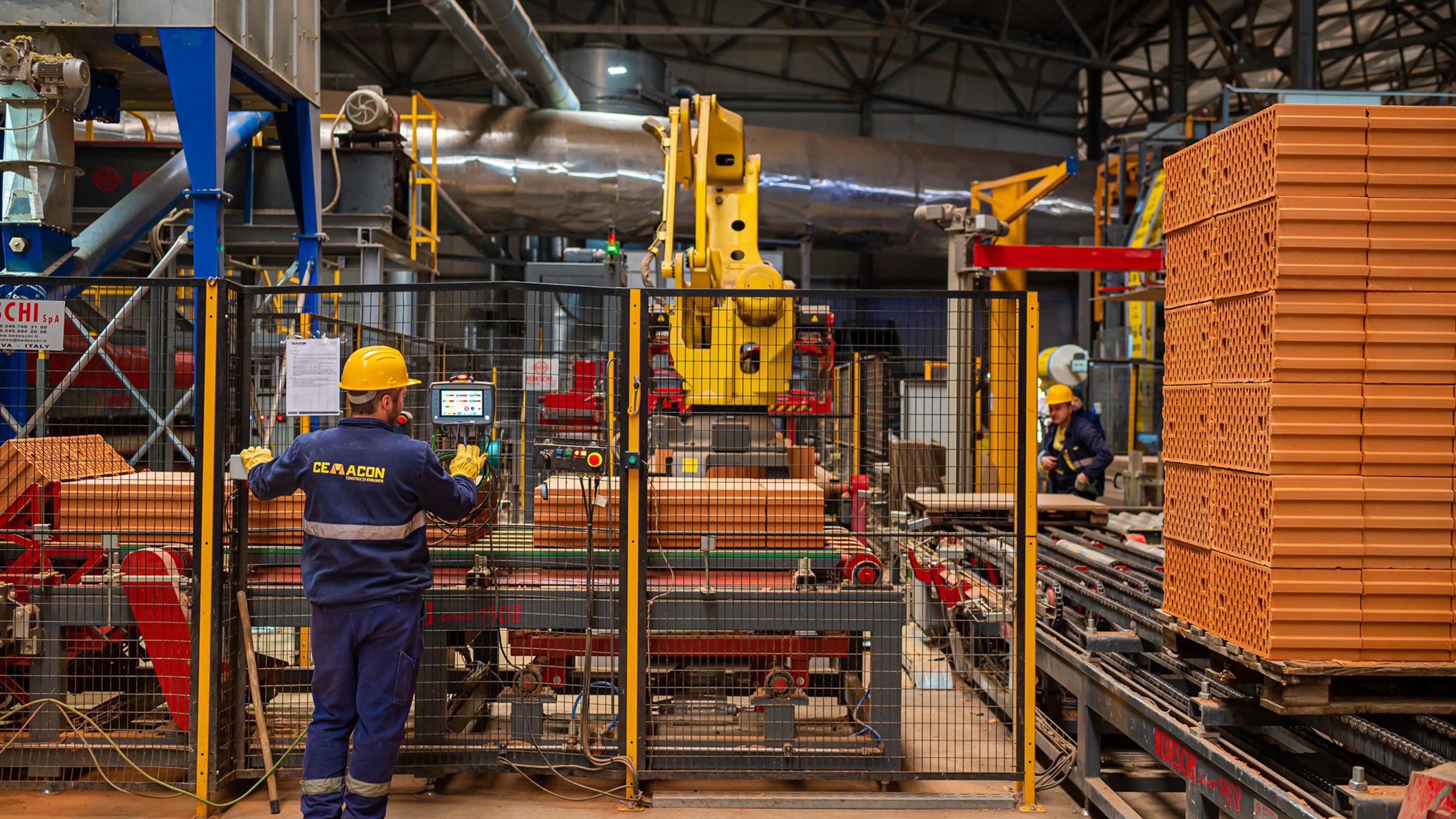 Man overlooking a factory machine