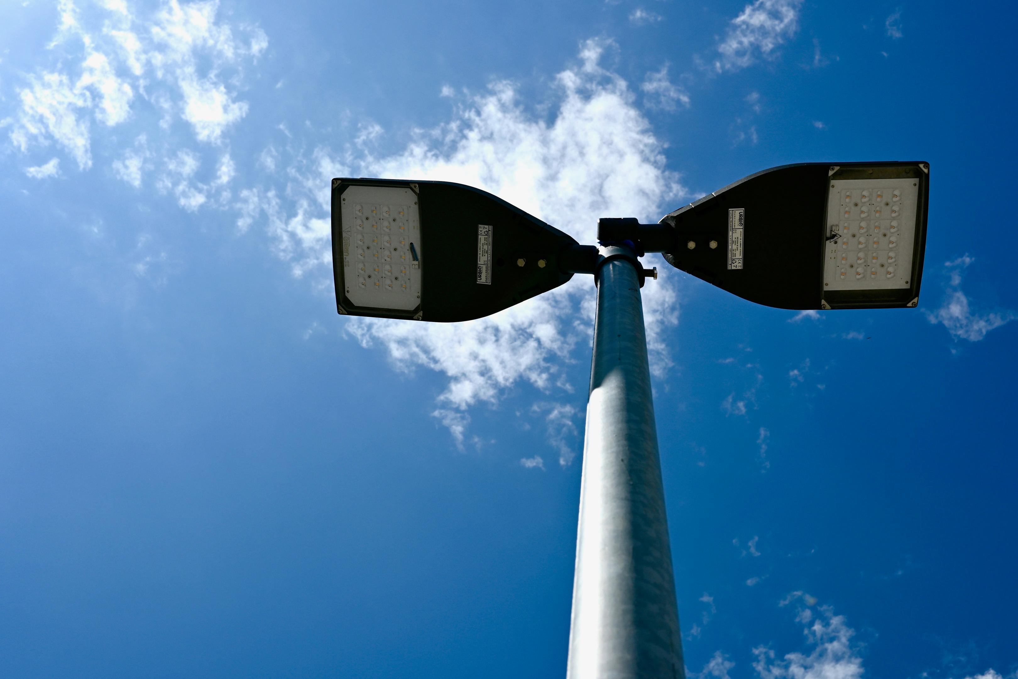 A picture of the street lightning from down below looking up underneath the street lightning, enabling us to see the LED technology used in the street lightening