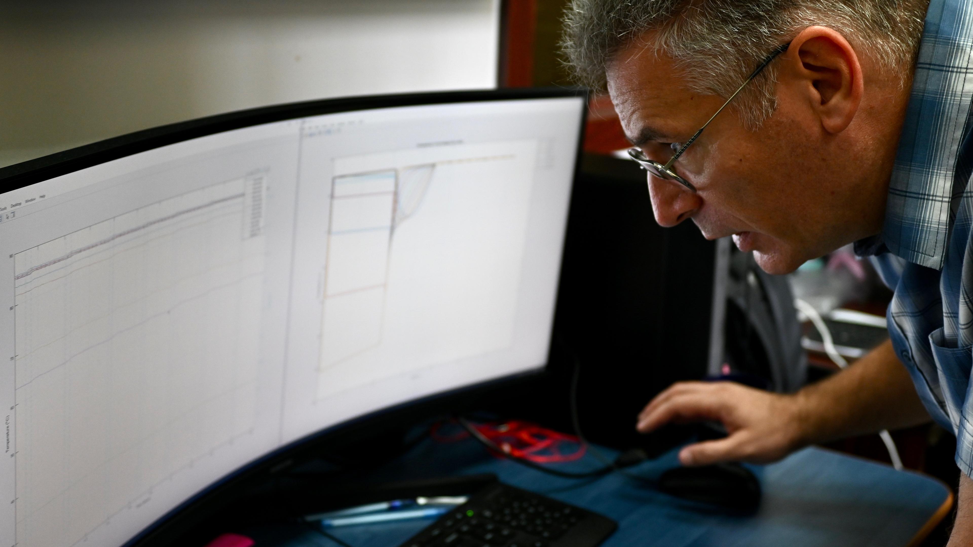 Dr Cristian Vasar is looking at the models that explain the temperature inside a water tank.