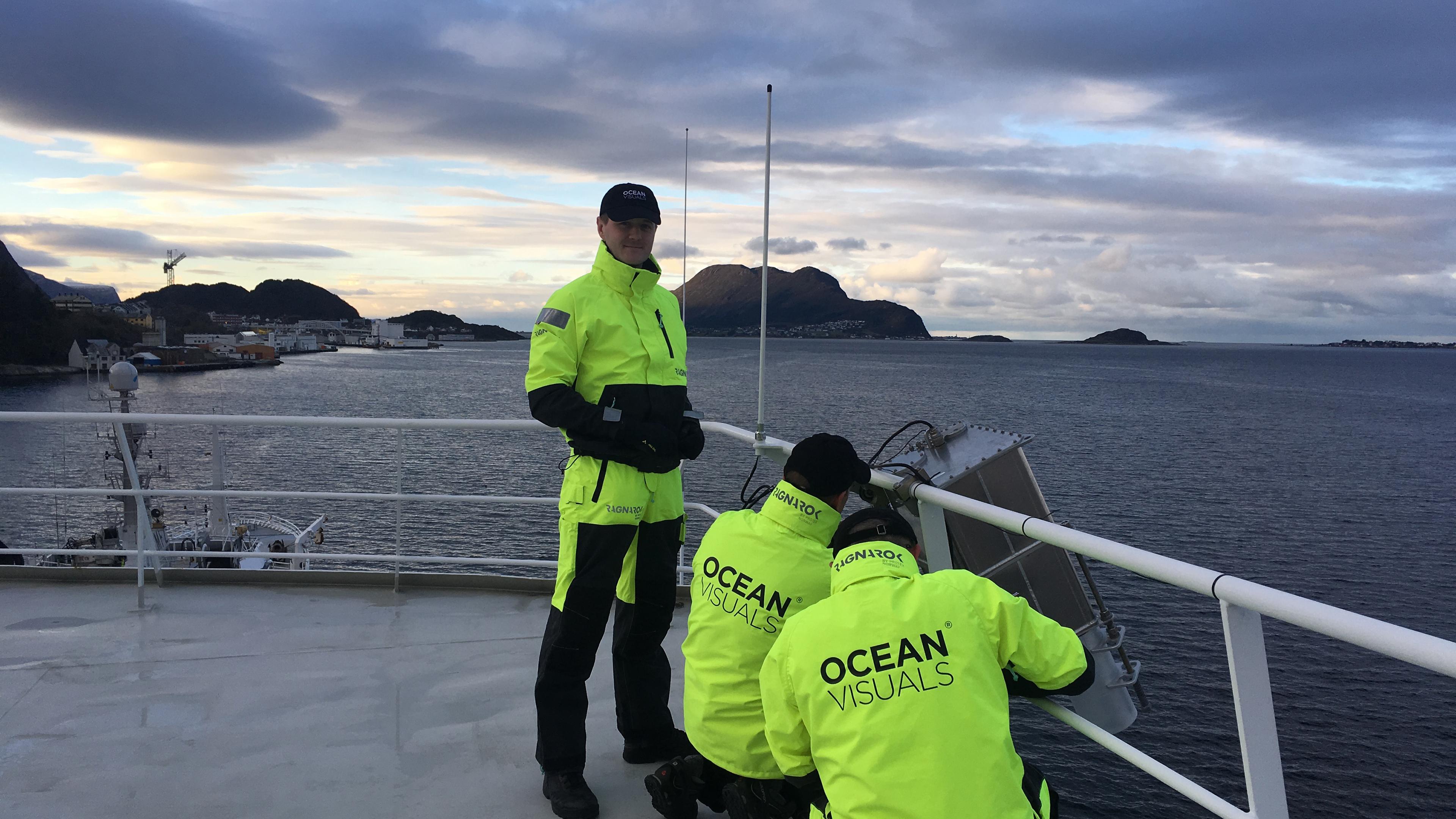 Men in yellow work clothing on a boat