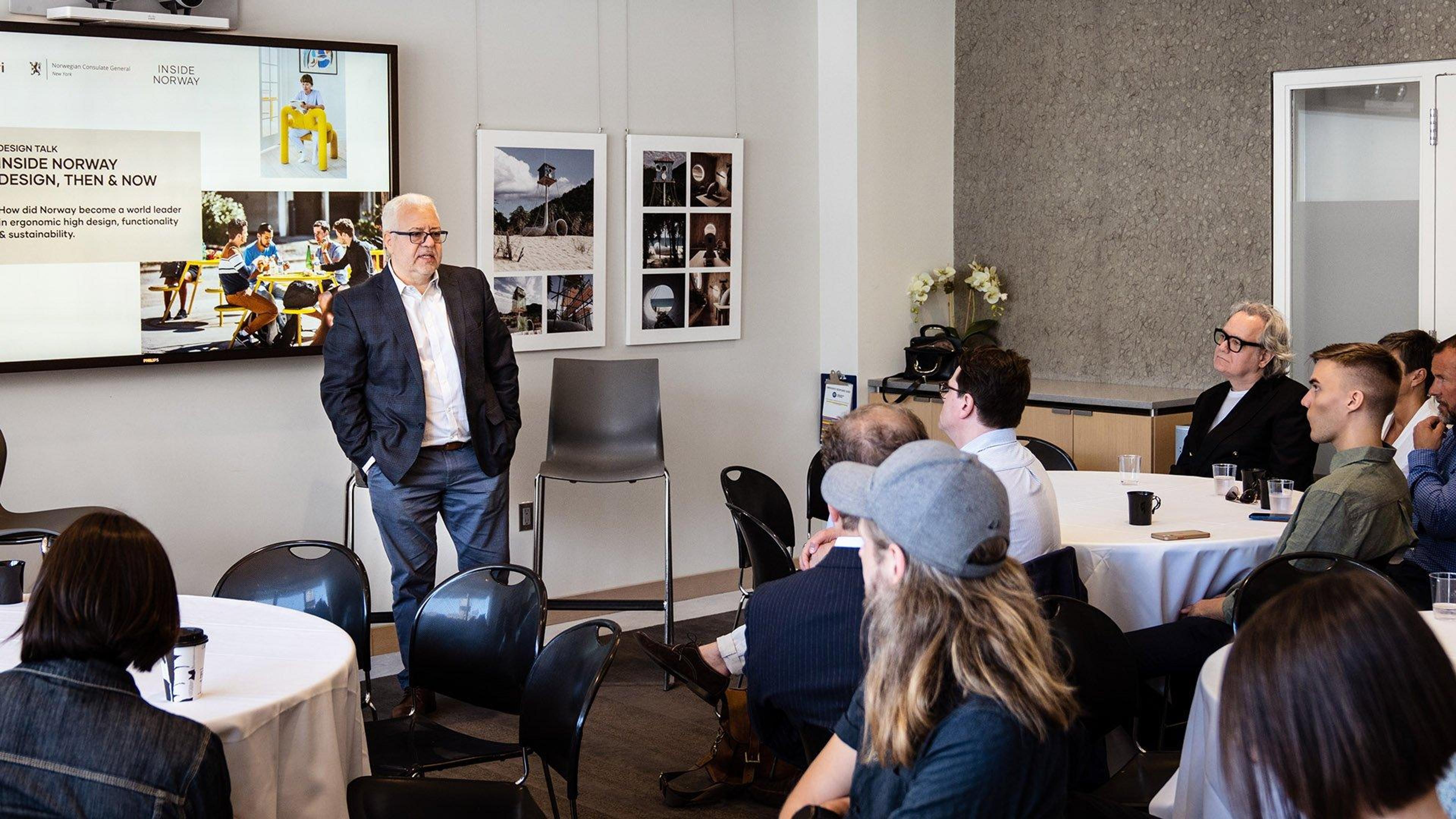 People in a room looking at a presentation