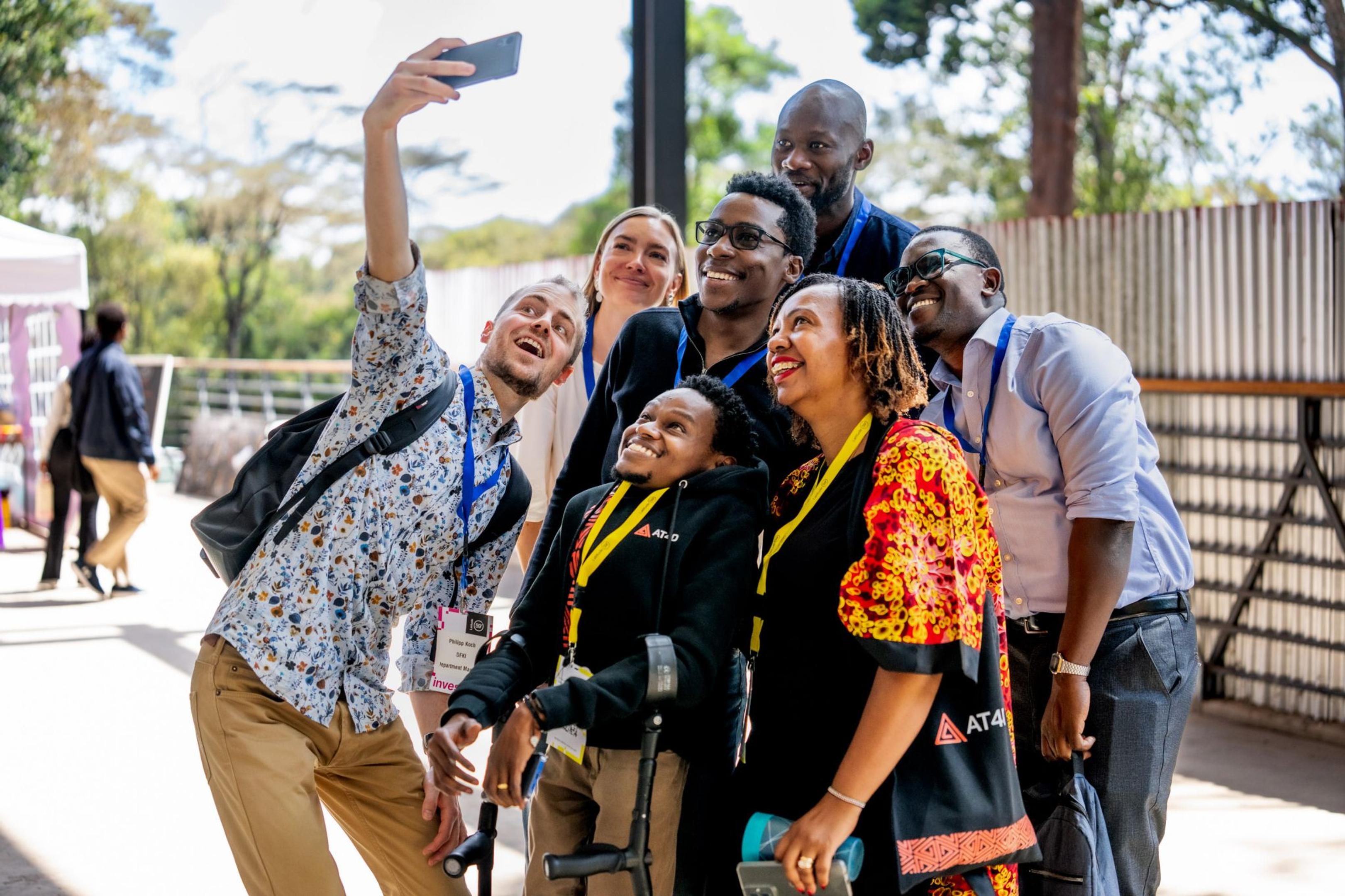 Group of people taking a selfie at a conference