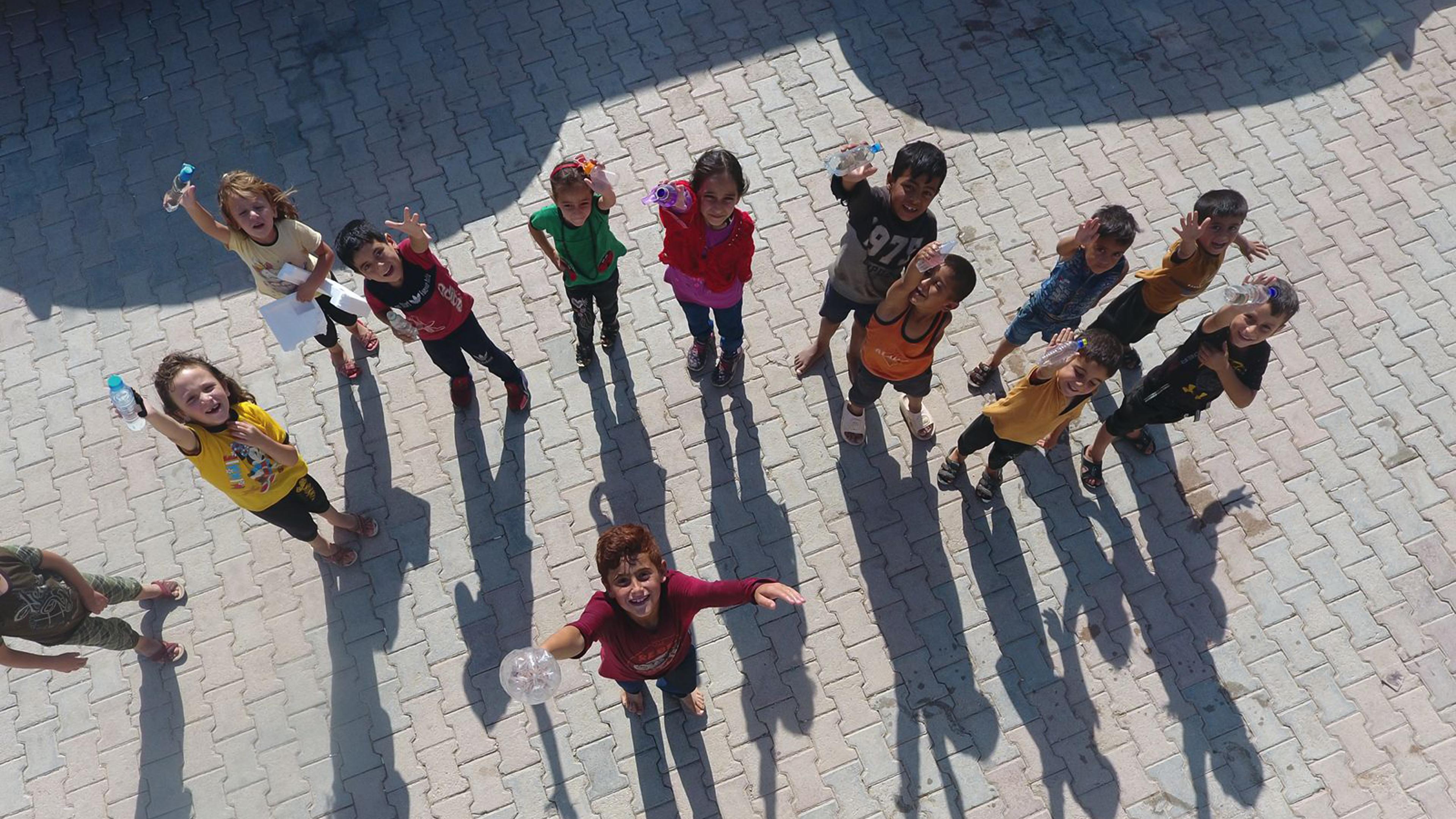 Children with water bottles