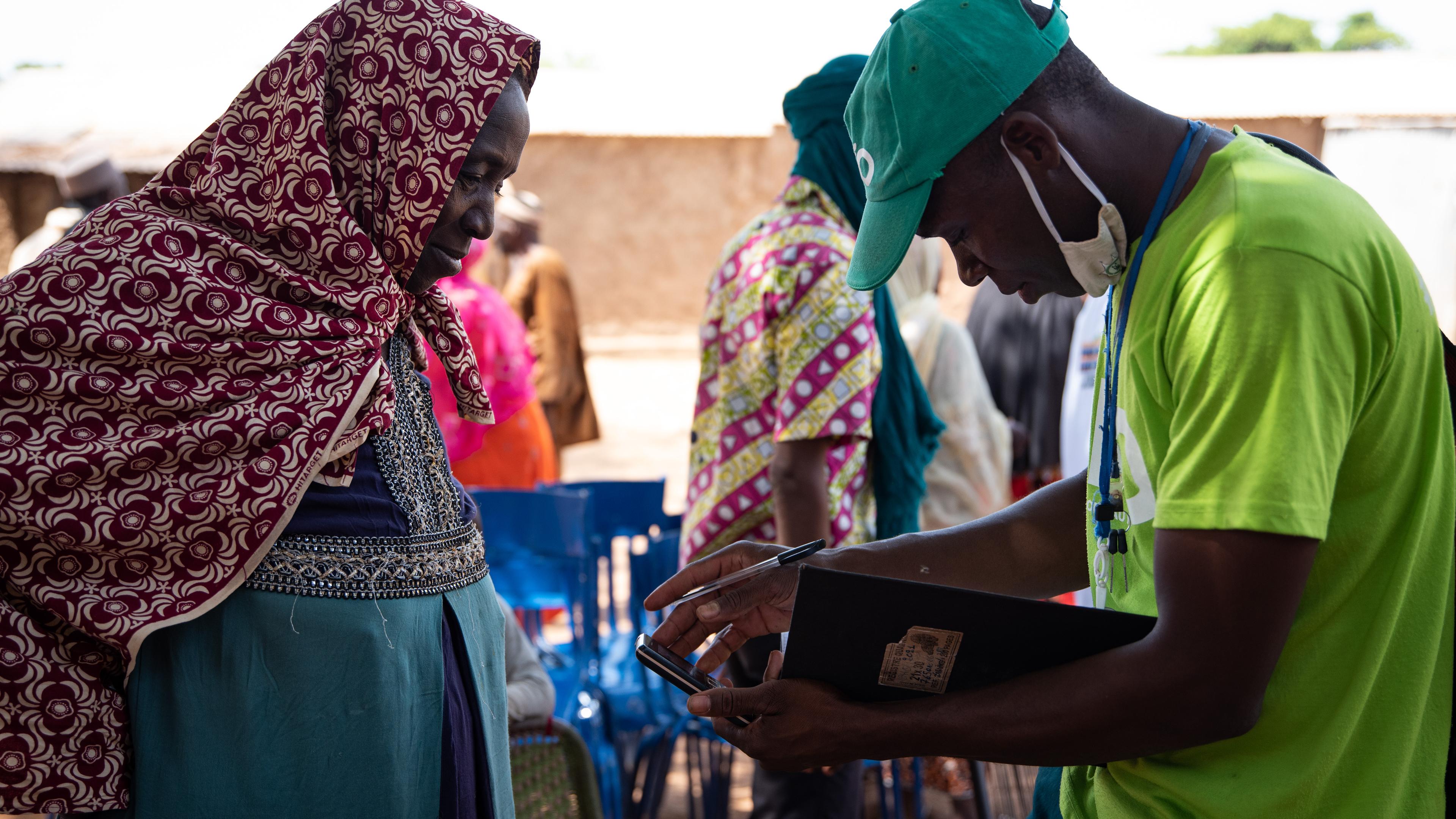 Woman signing up for crop insurance