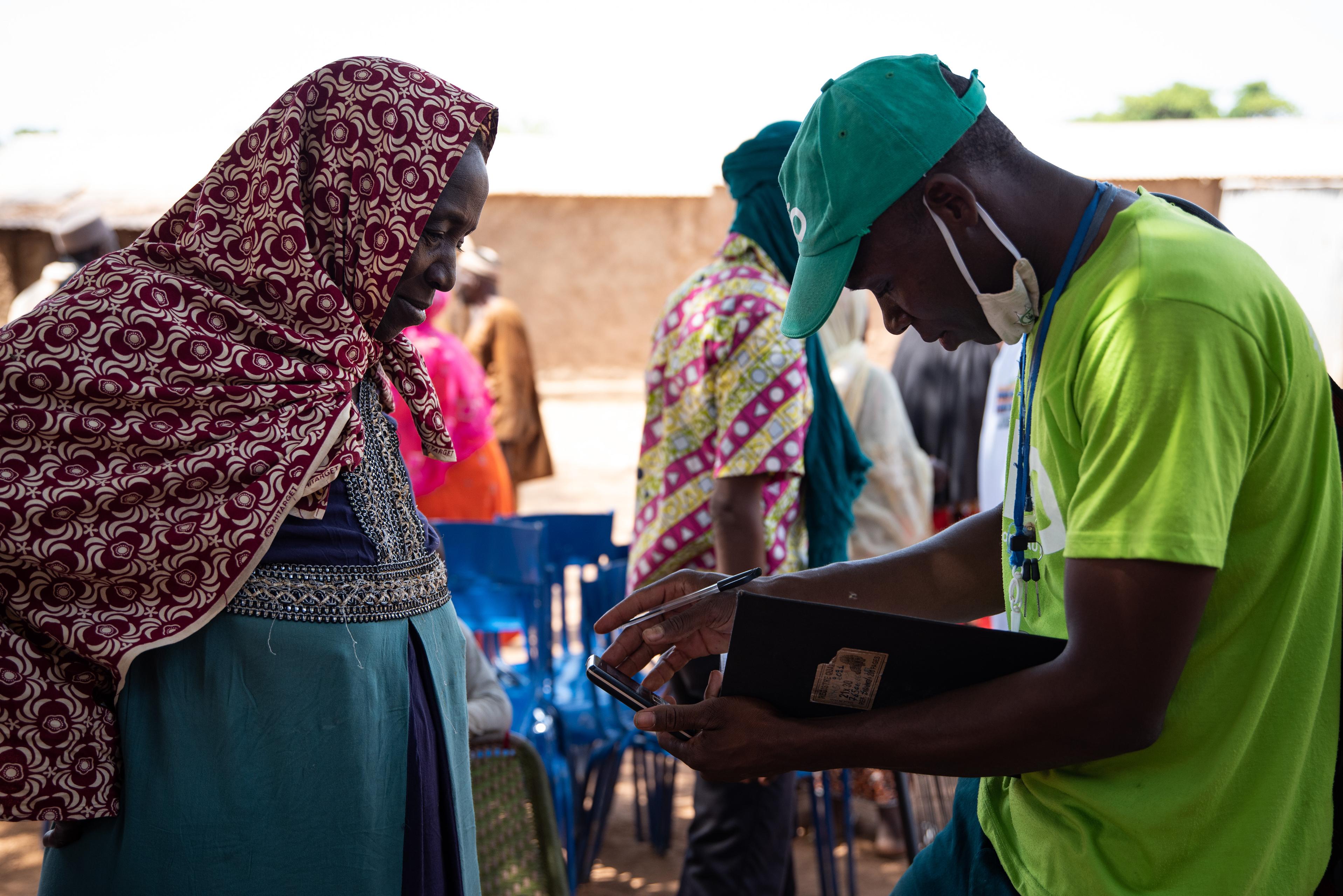 Woman signing up for crop insurance