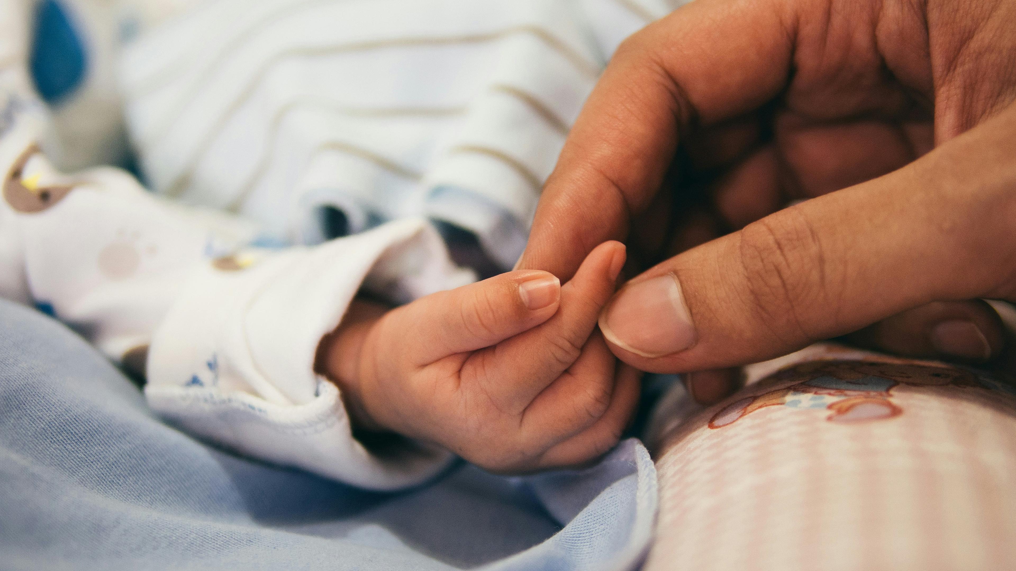 Child holding hand
