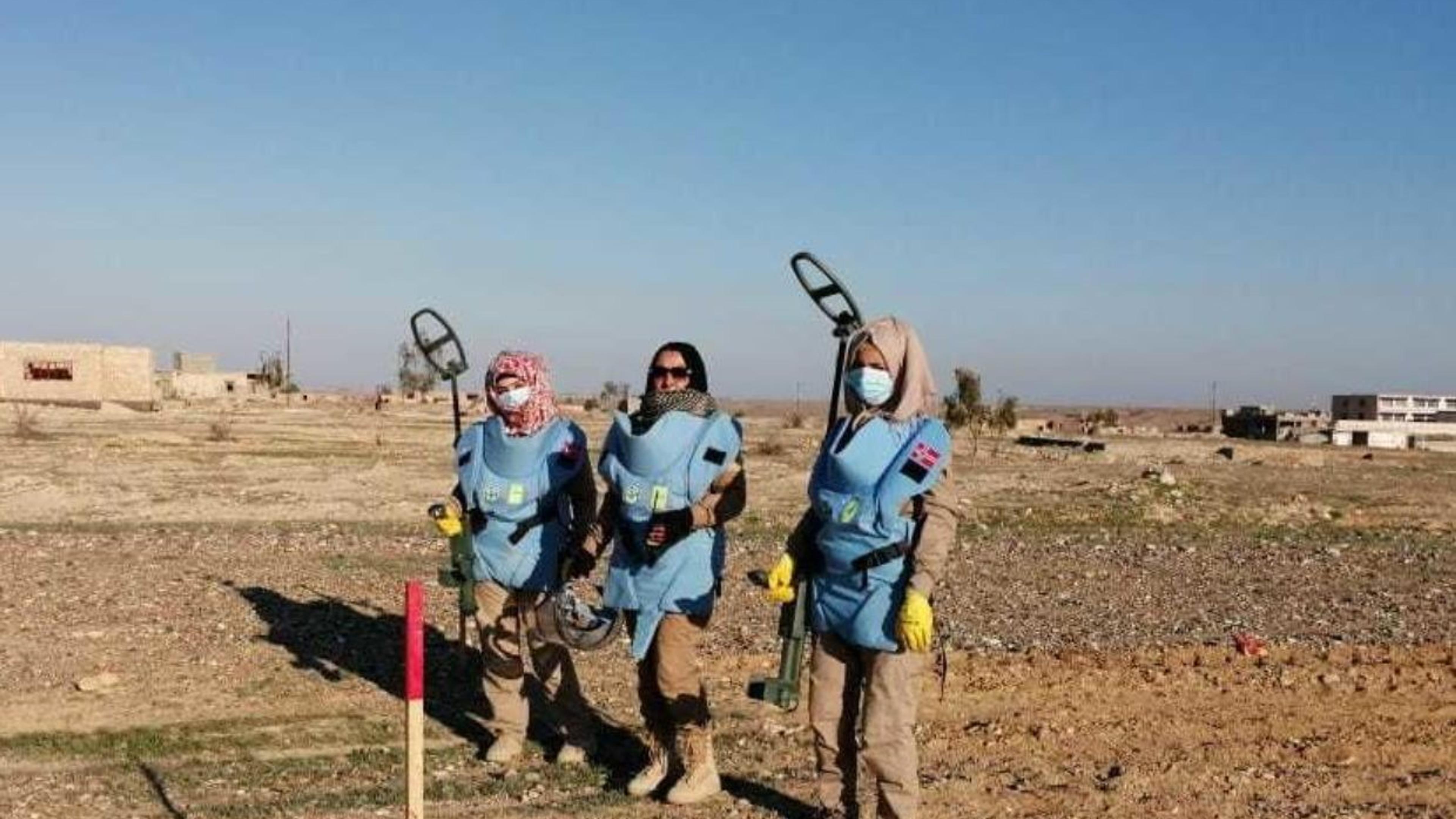 Millitary women searching for mines