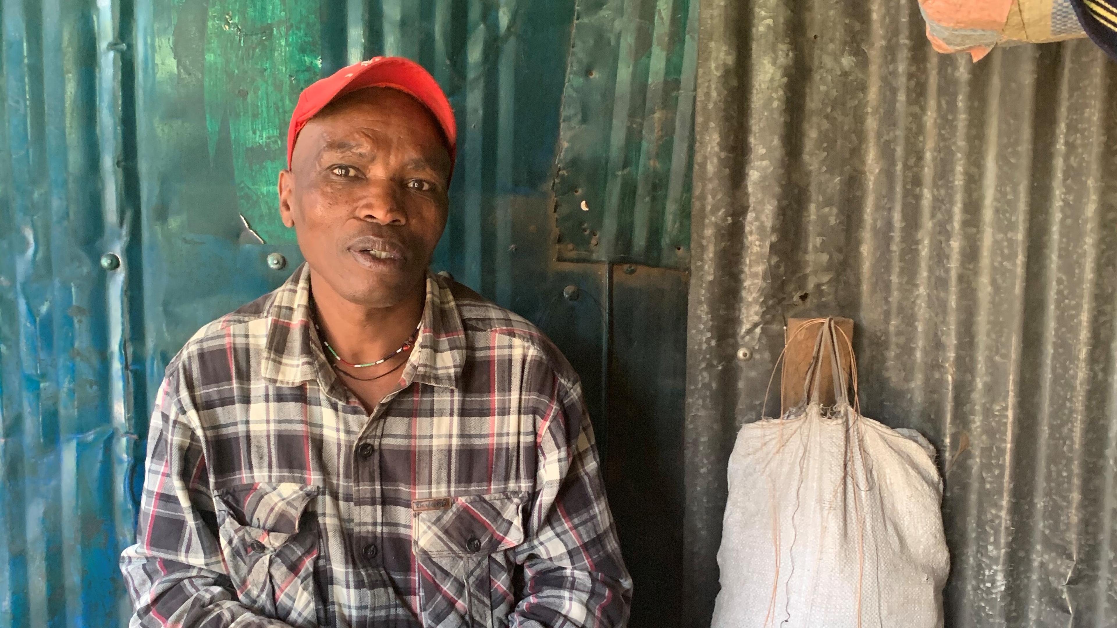 Man with shoe repair business