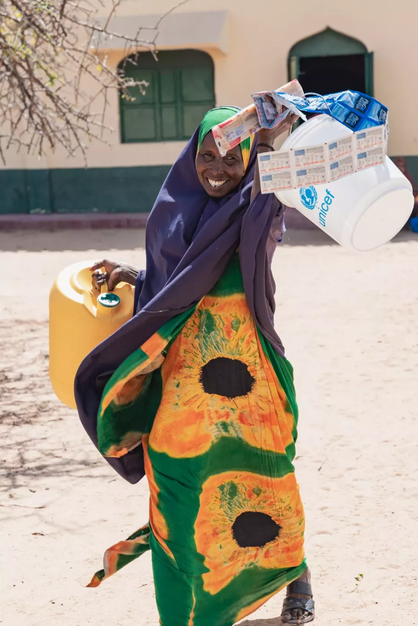 Woman holding buckets