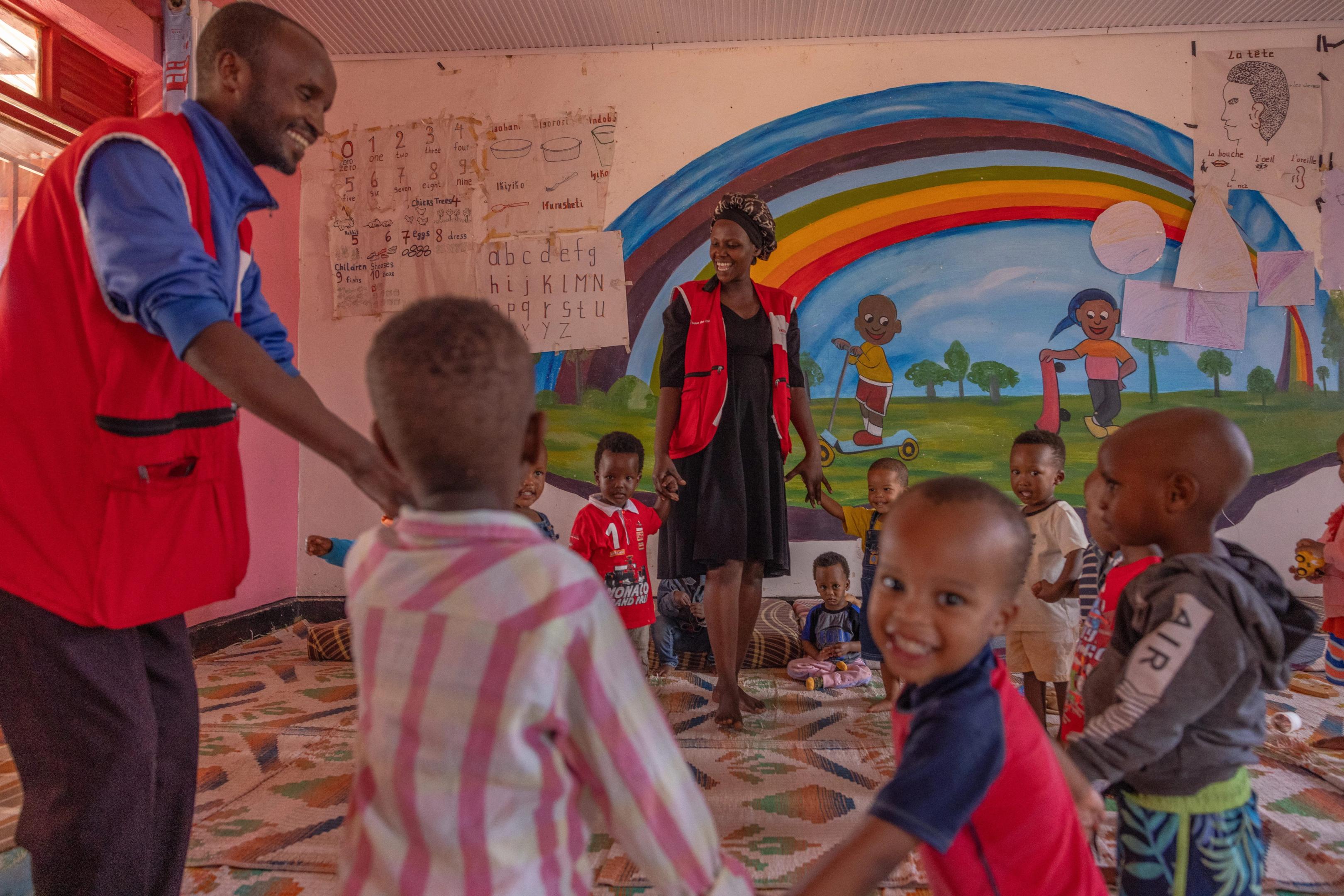 Caregivers encouraging exploration and creativity through play