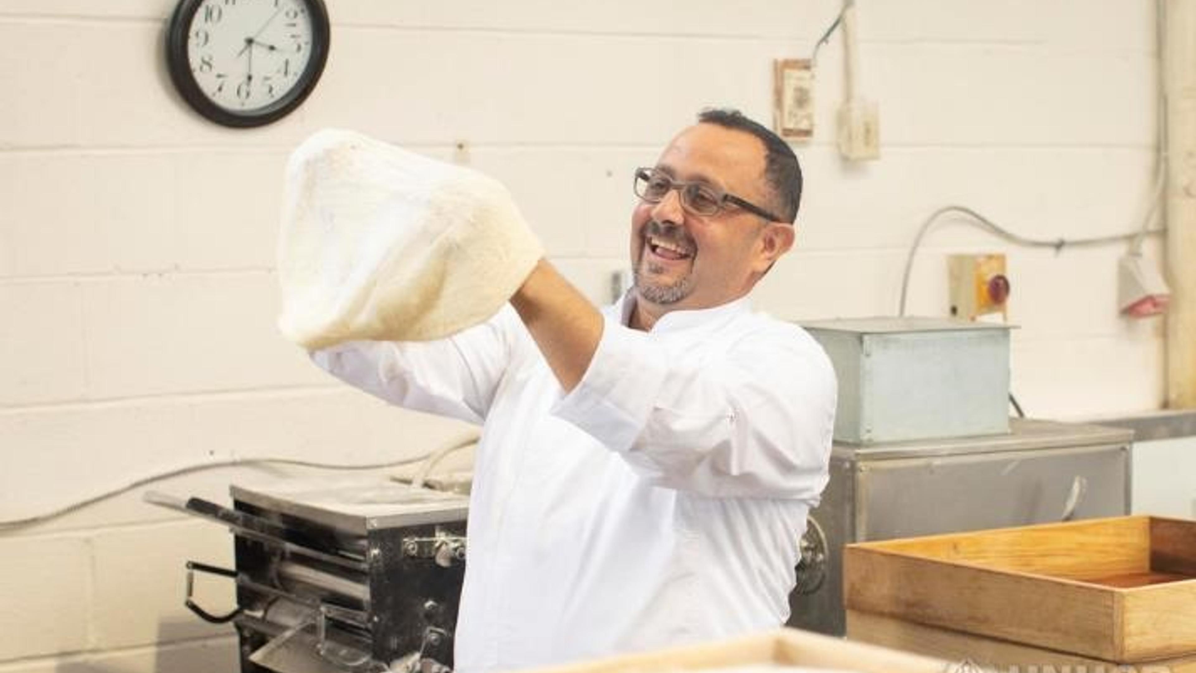 Man making pizza dough