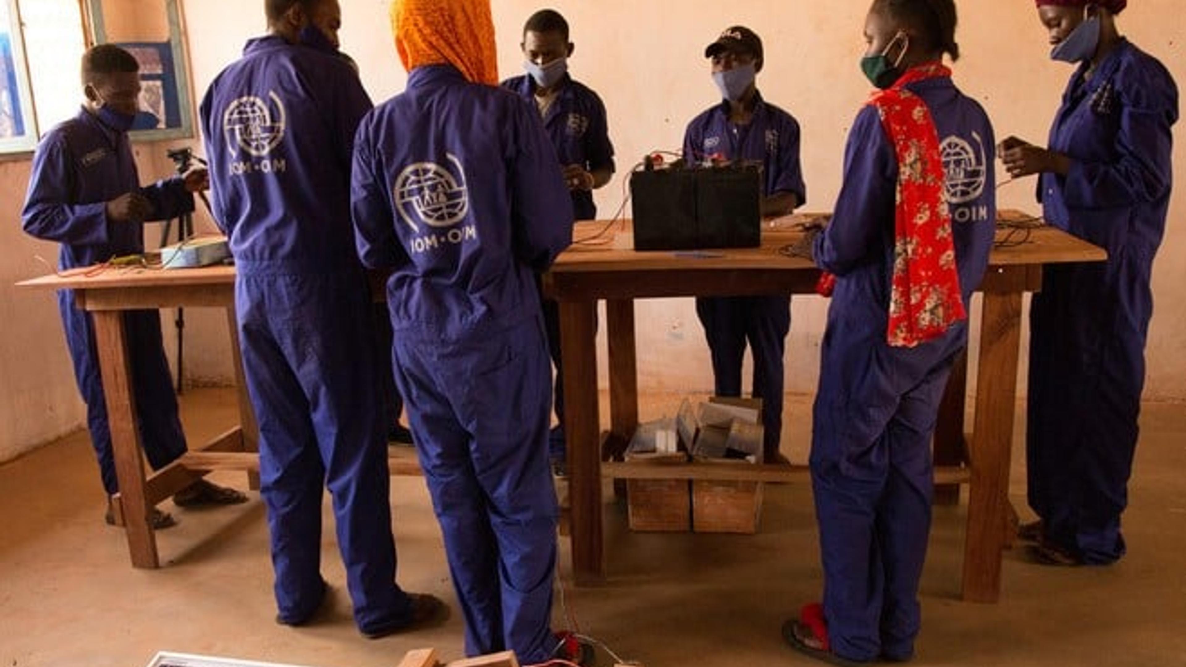 Youths learn how to repair solar panels